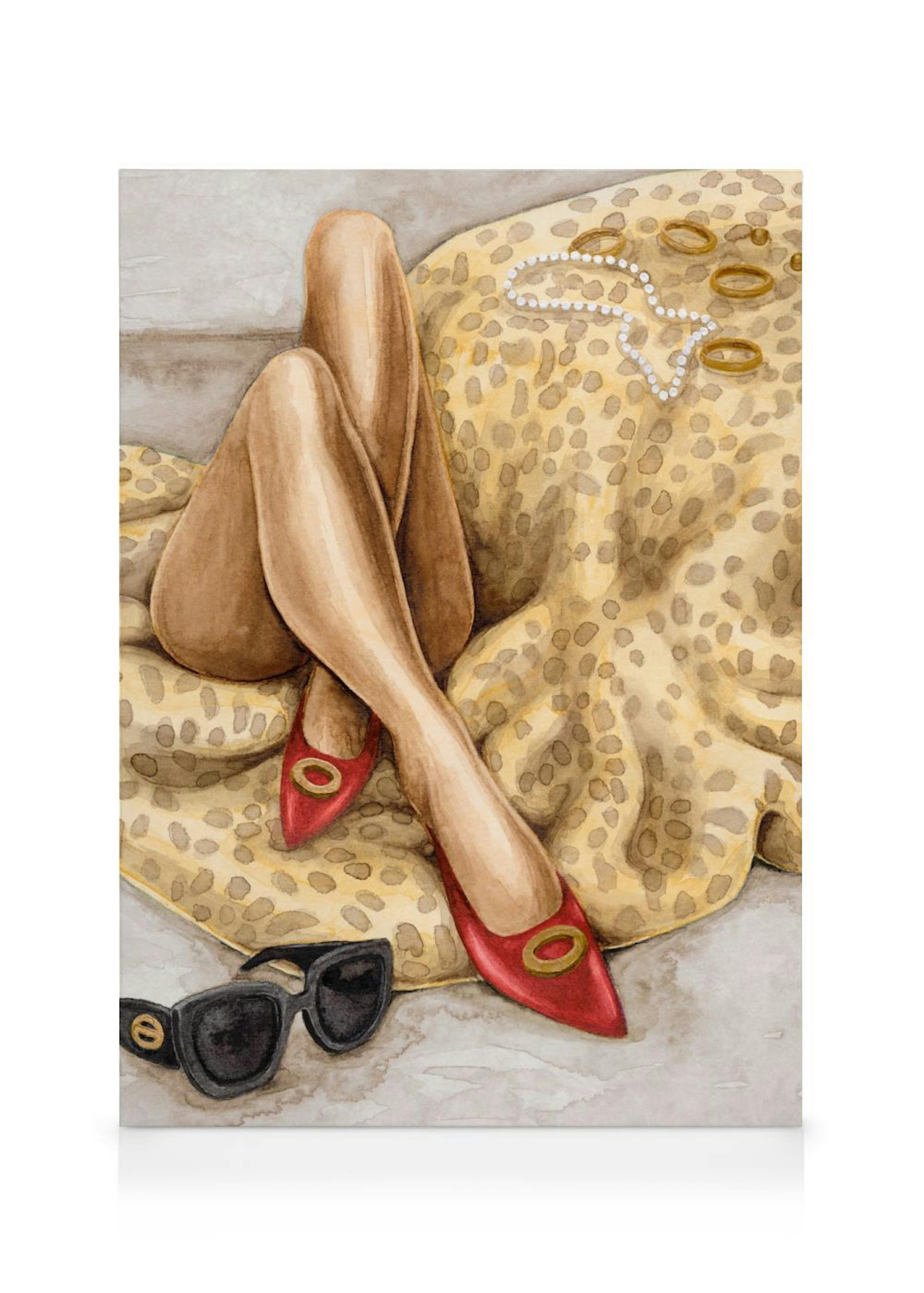 Fashionable girls legs with red shoes on a leopard print canvas, alongside sunglasses and jewelry.