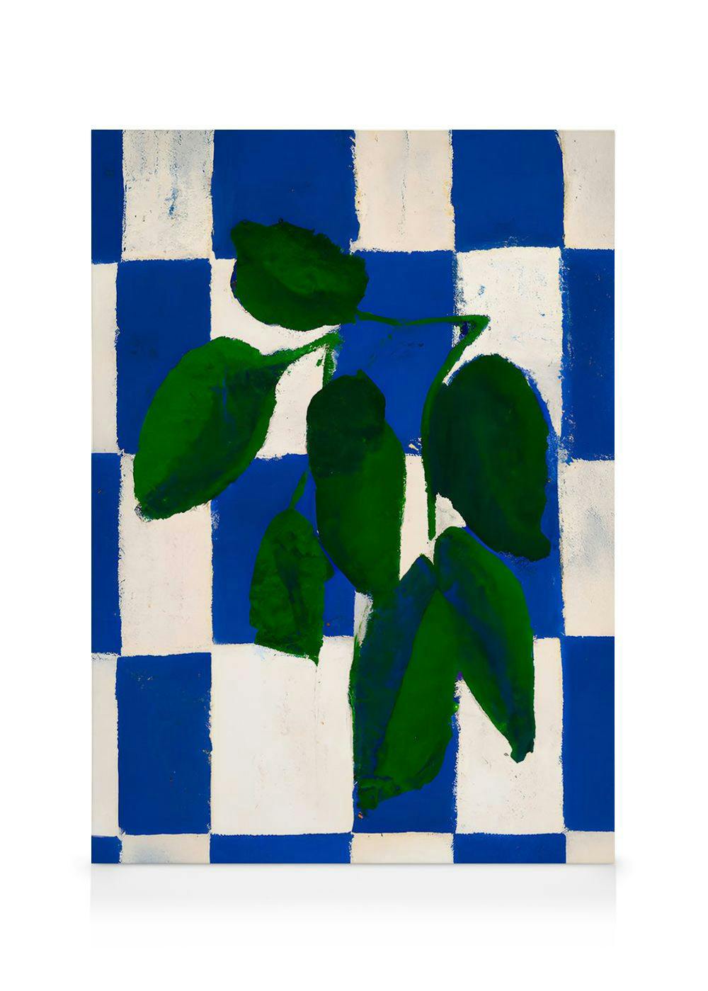 A canvas print featuring green leaves on a bold blue and white checkerboard background.