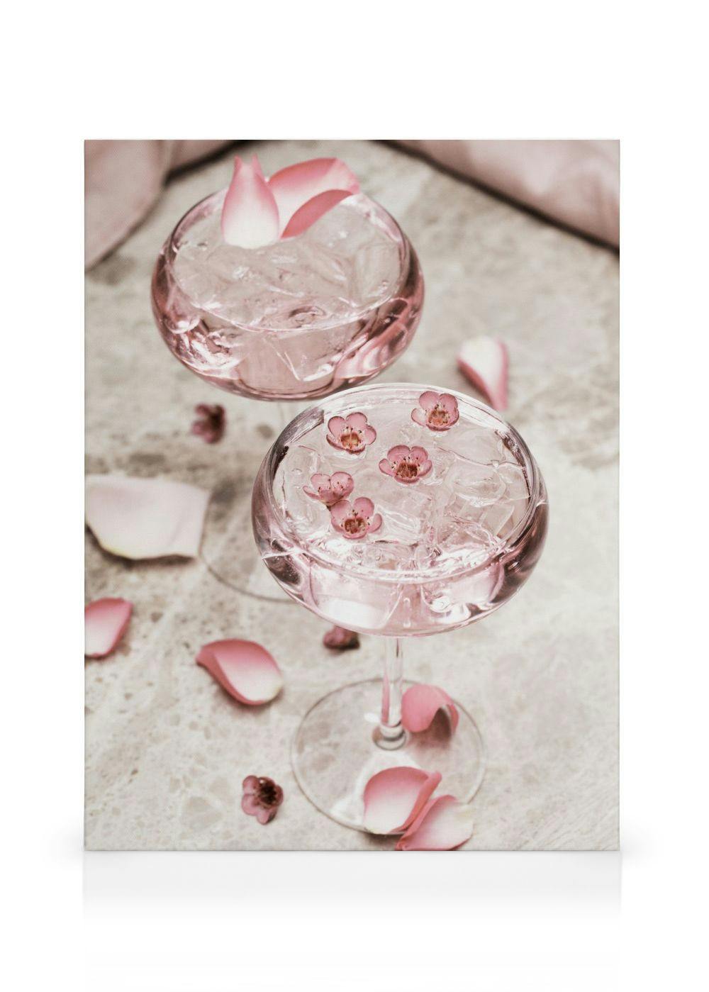 Rose Cocktail No1 canvas print, pink cocktails with ice, rose petals, and flowers in decorative glasses on a beige surface.