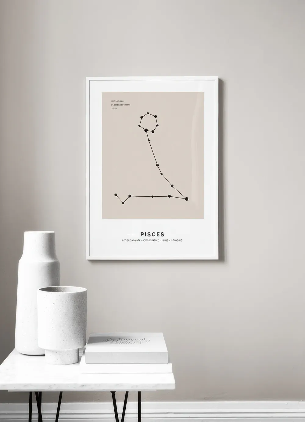 A personalised print featuring the Pisces constellation on a beige background, displayed above a white marble side table with tw