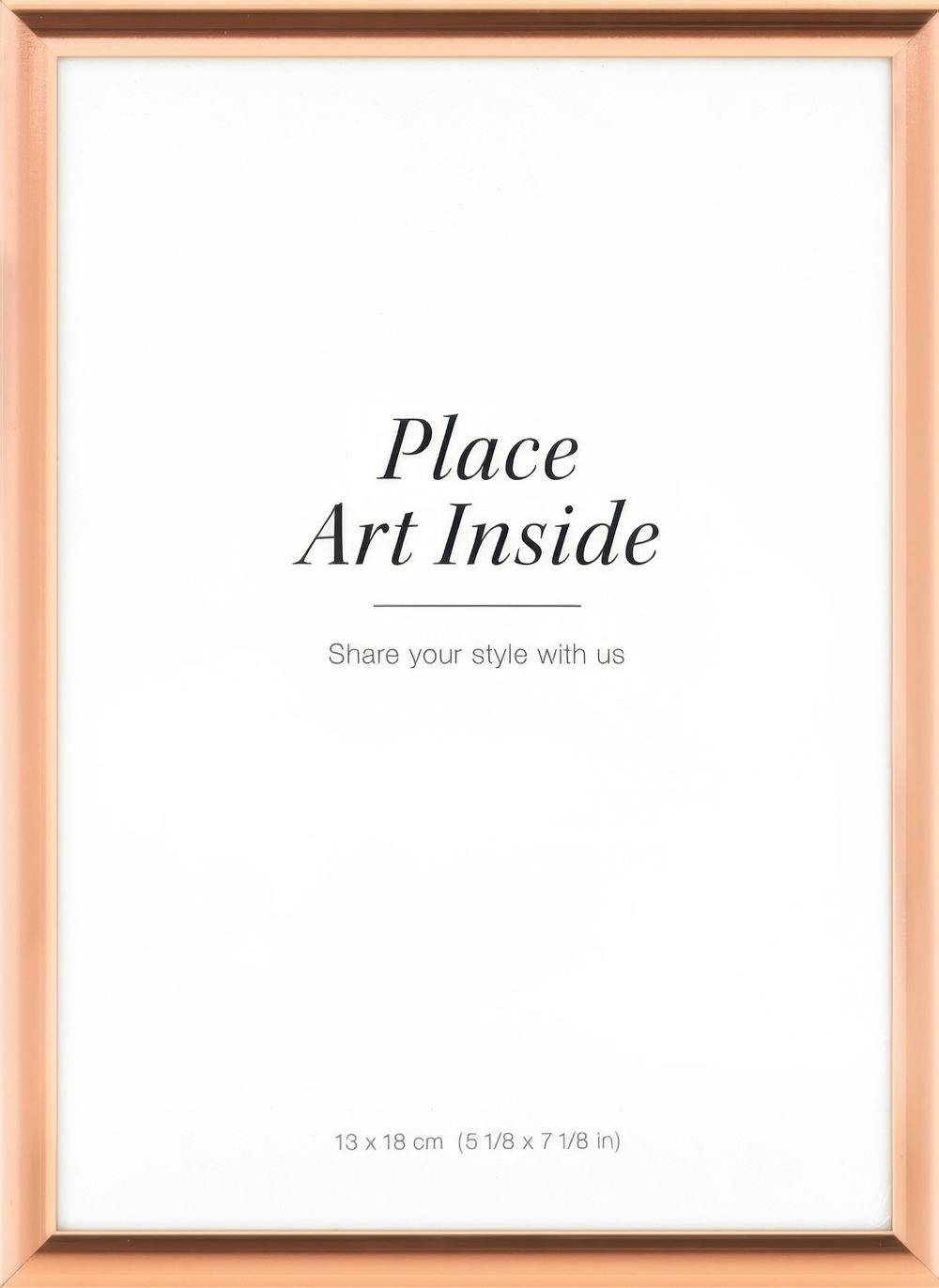 Copper metal picture frame with a white insert that says Place Art Inside.