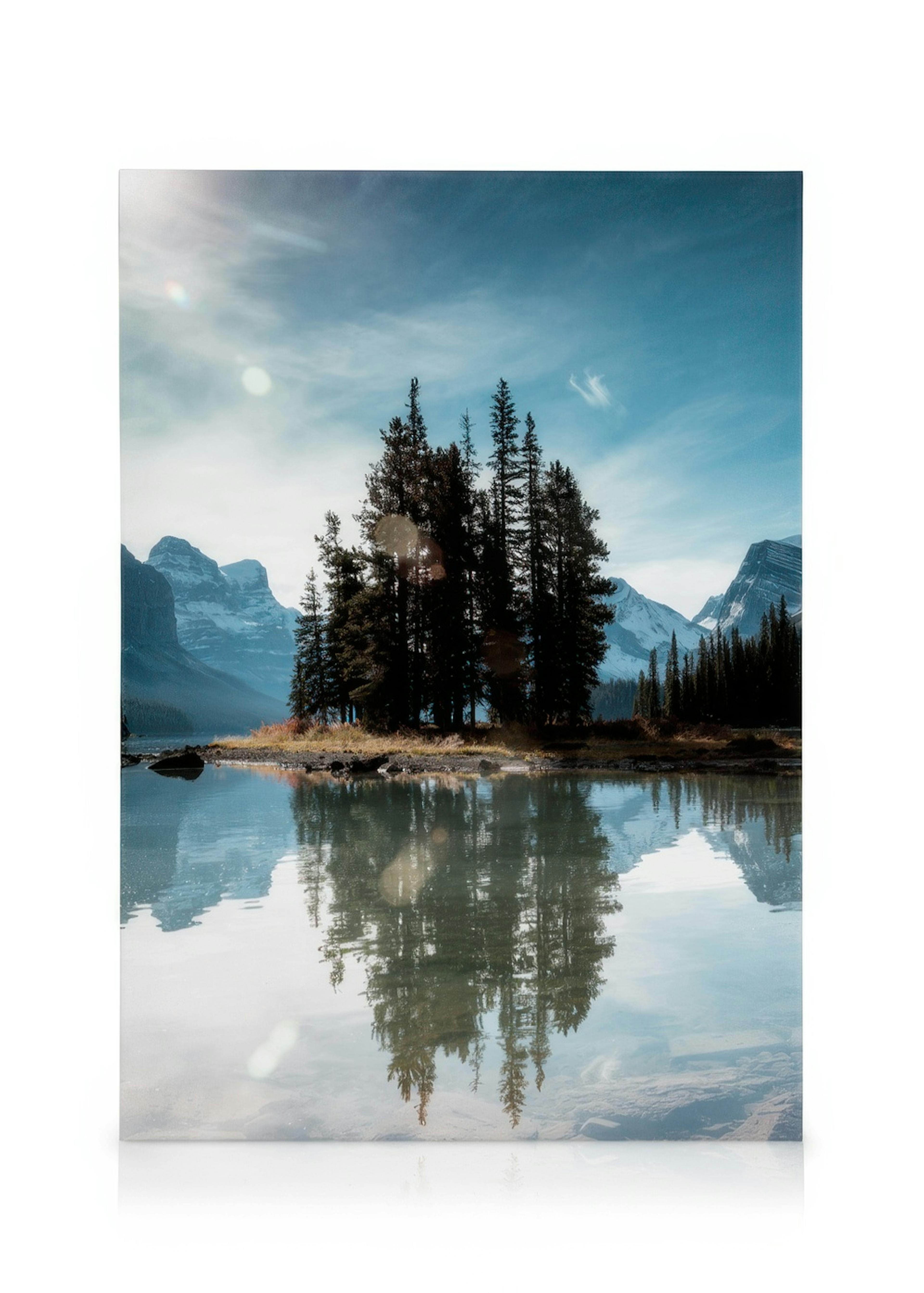 Spirit Island canvas print, a serene lake with an evergreen tree island reflecting on the calm water, snow-capped mountains and 