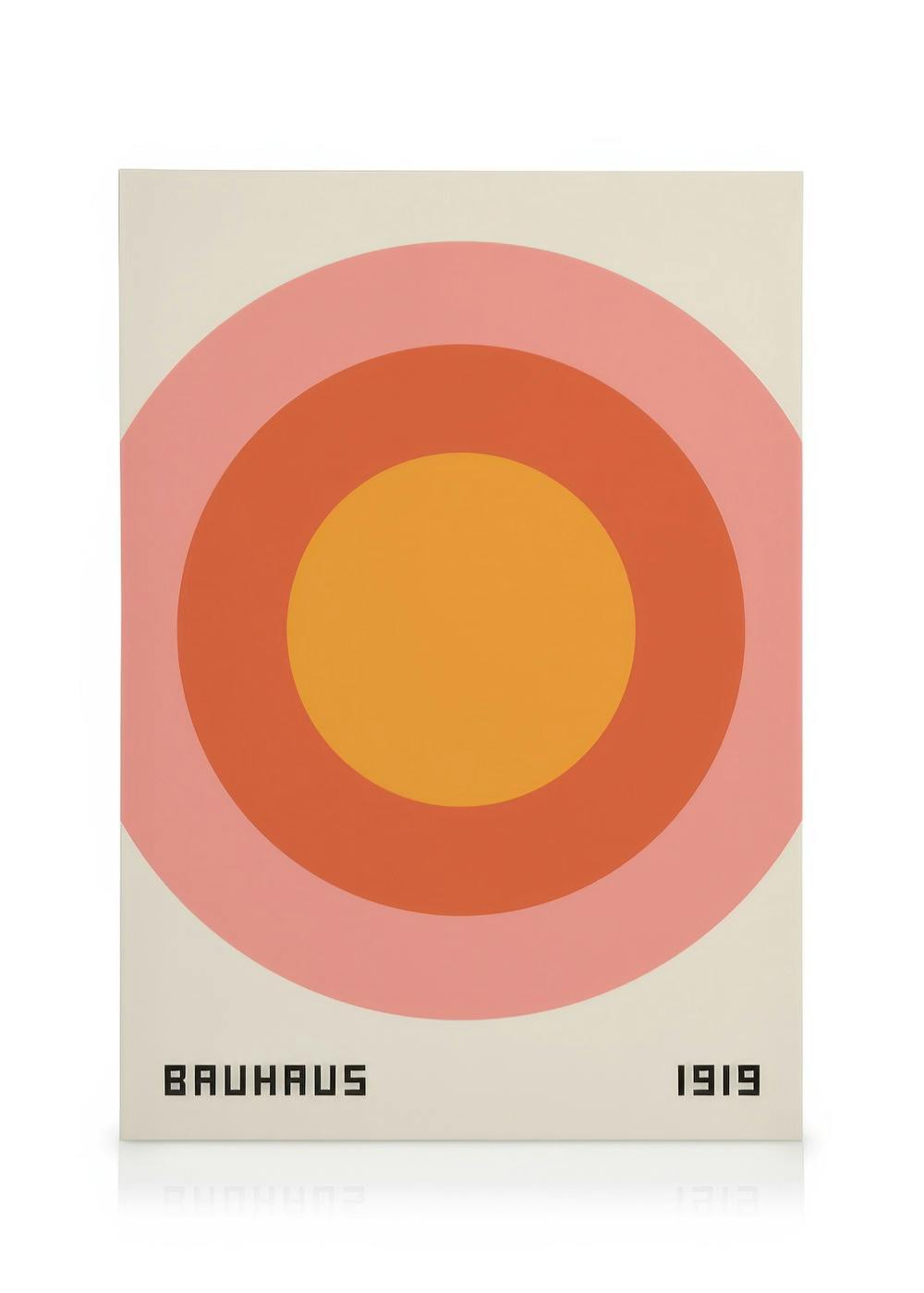 Bauhaus 1919 canvas print with three concentric circles in yellow, red, and pink on a beige background.