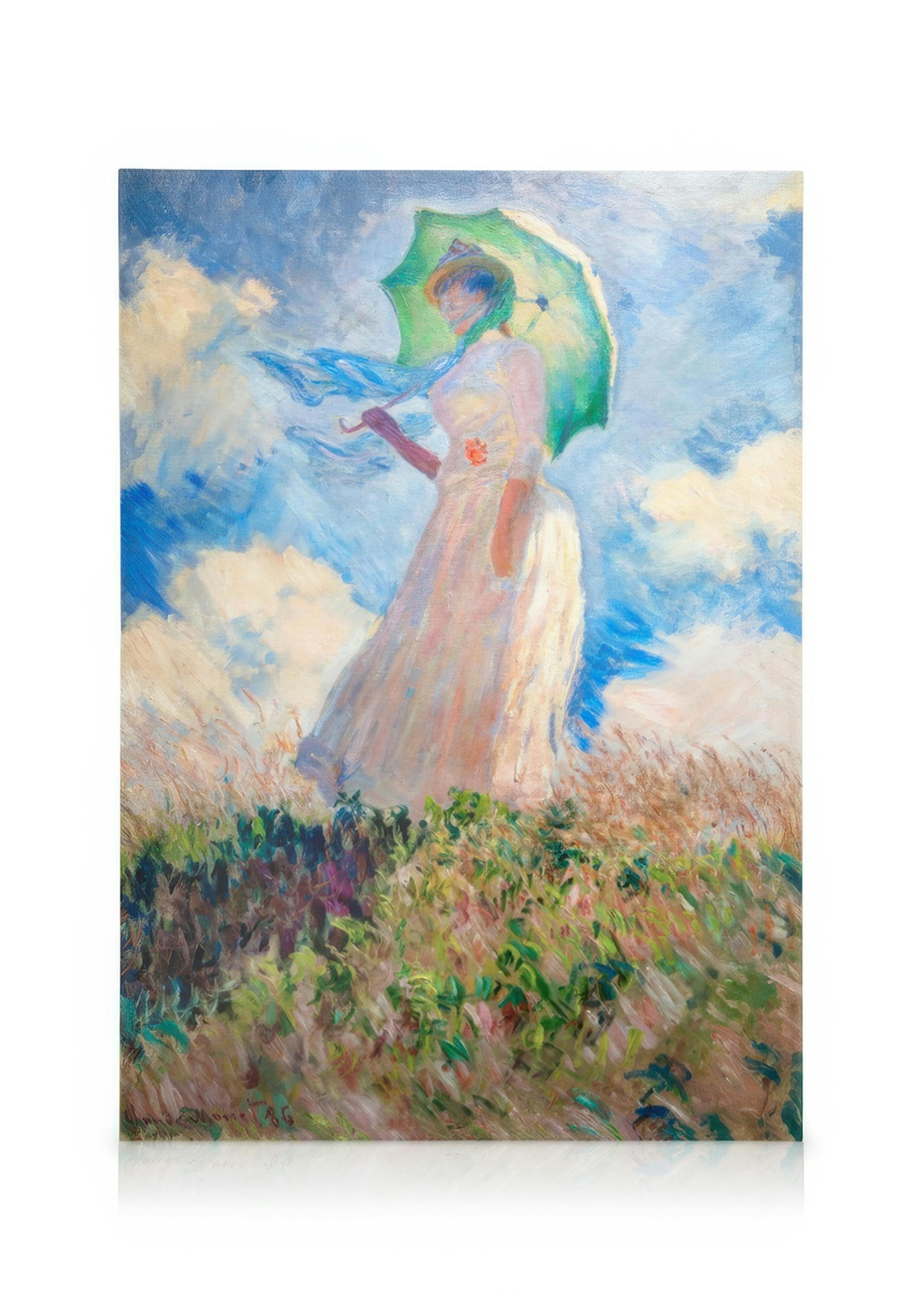 Canvas van een vrouw met een parasol op een heuvel, hangend in een modern interieur boven een dressoir.