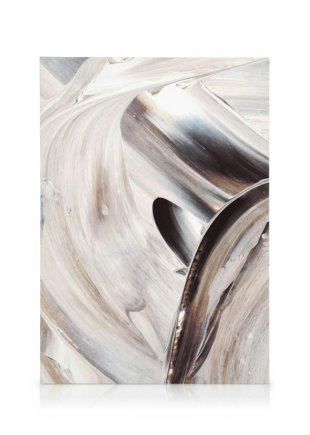 Canvas print with swirling metallic curves in white, grey, and brown, creating a sense of movement.