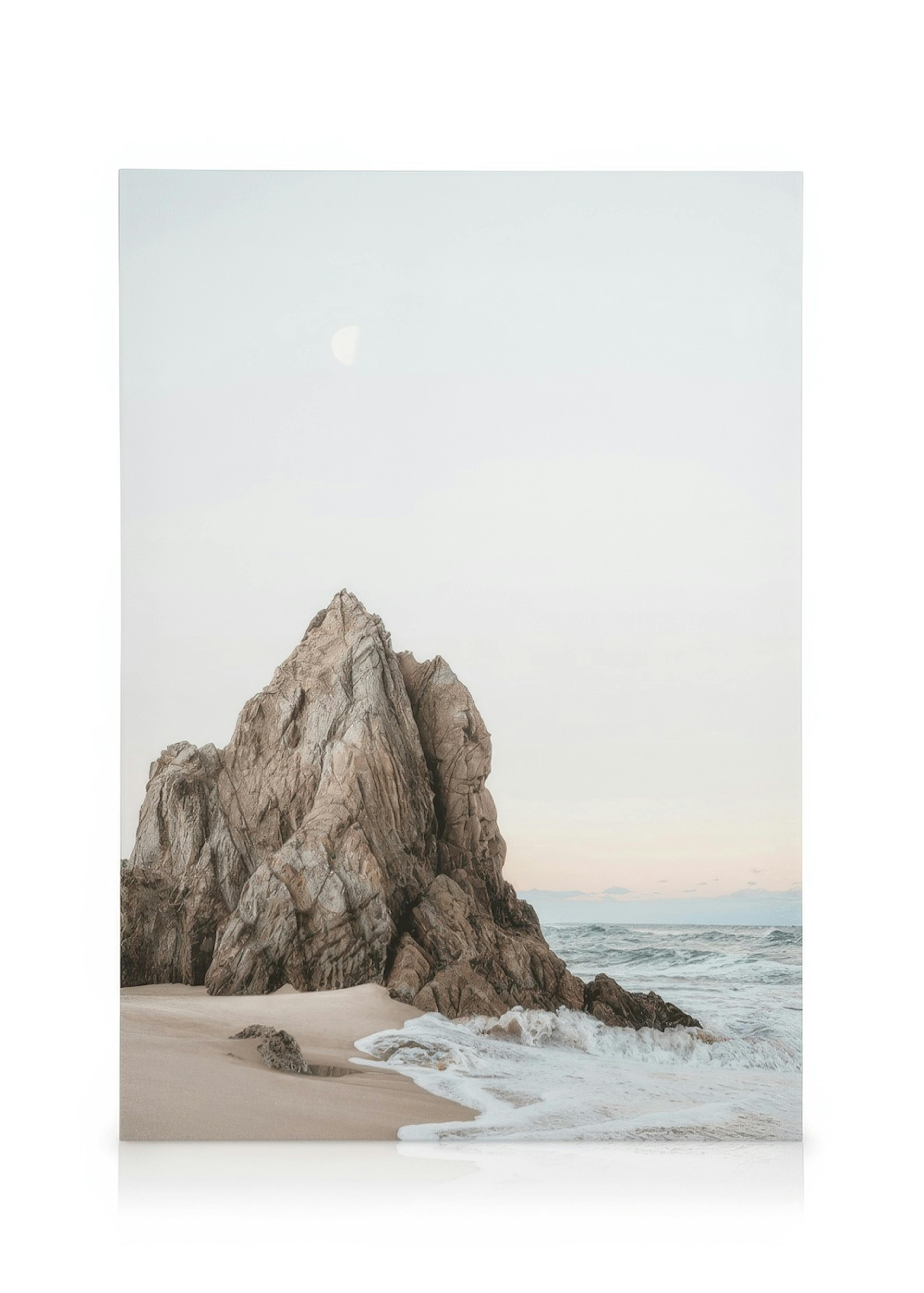 Canvas print of large rock on sandy beach with waves under pale sky and crescent moon, Cliffs at Sunset design.