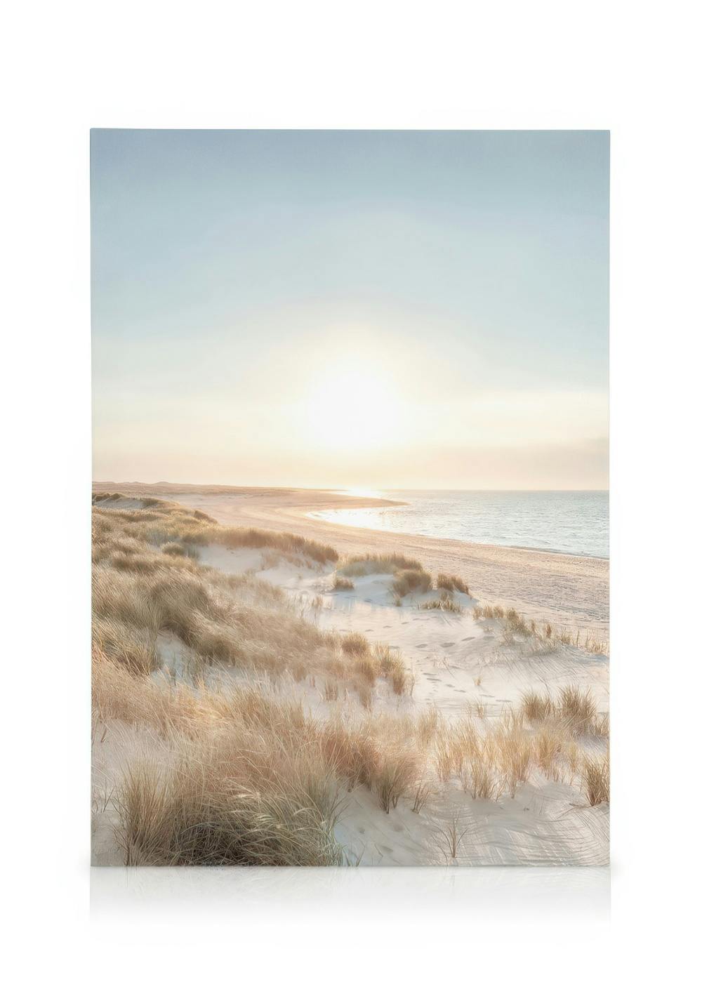 Canvas art of a serene beach at sunset with golden sand dunes and sparse grass under a soft, glowing sky.