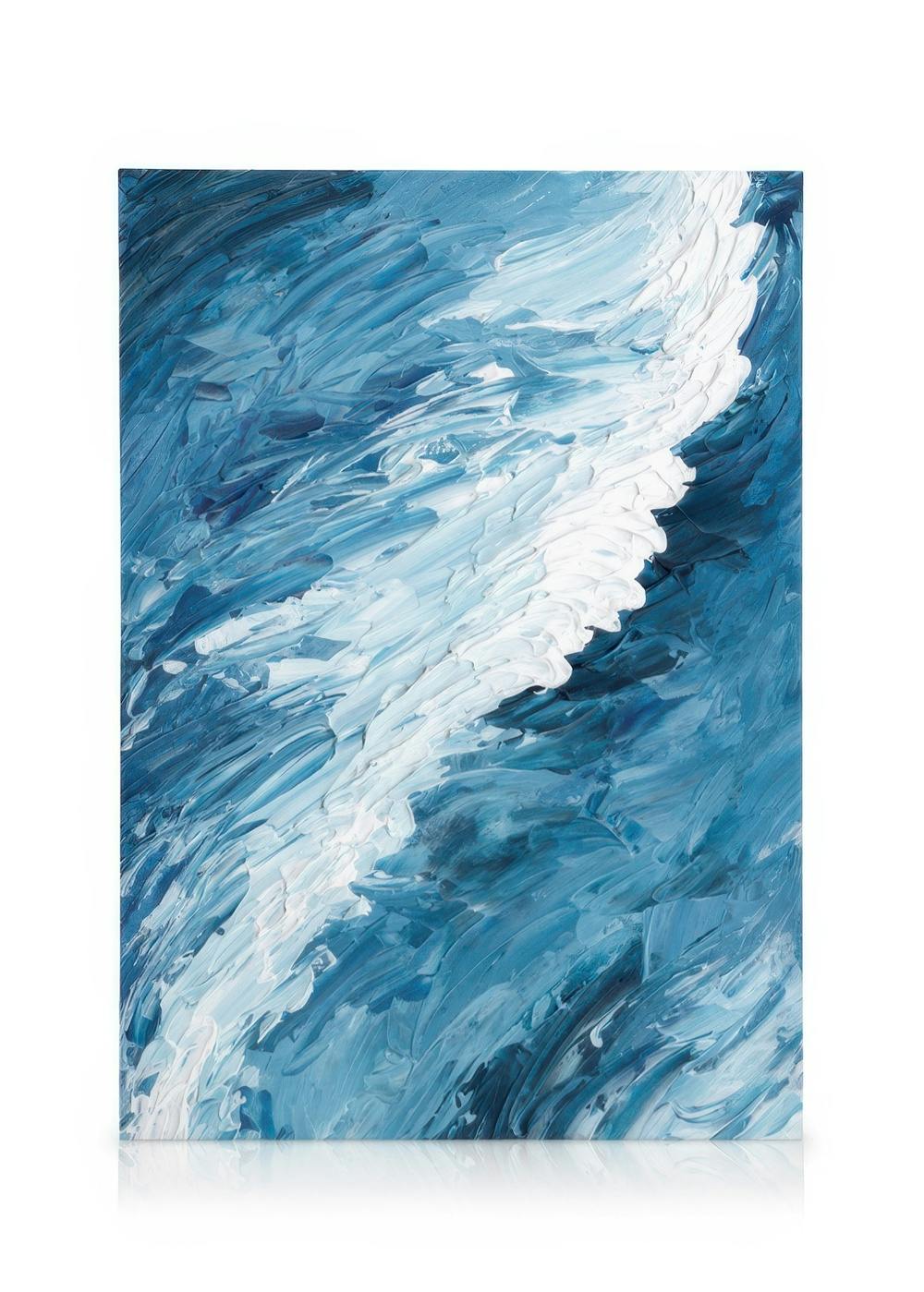 Abstract canvas art with bold blue and white brushstrokes creating a swirling pattern resembling waves or a stormy sea.