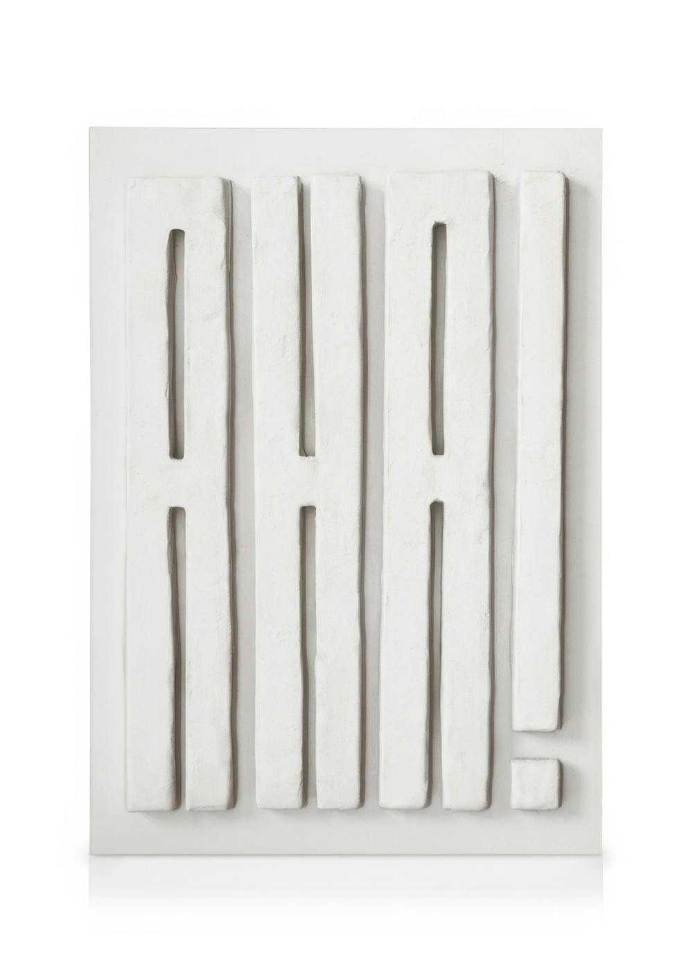 White textured canvas art with raised letters spelling AHA! and an exclamation mark, creating a minimalist, sculptural design.