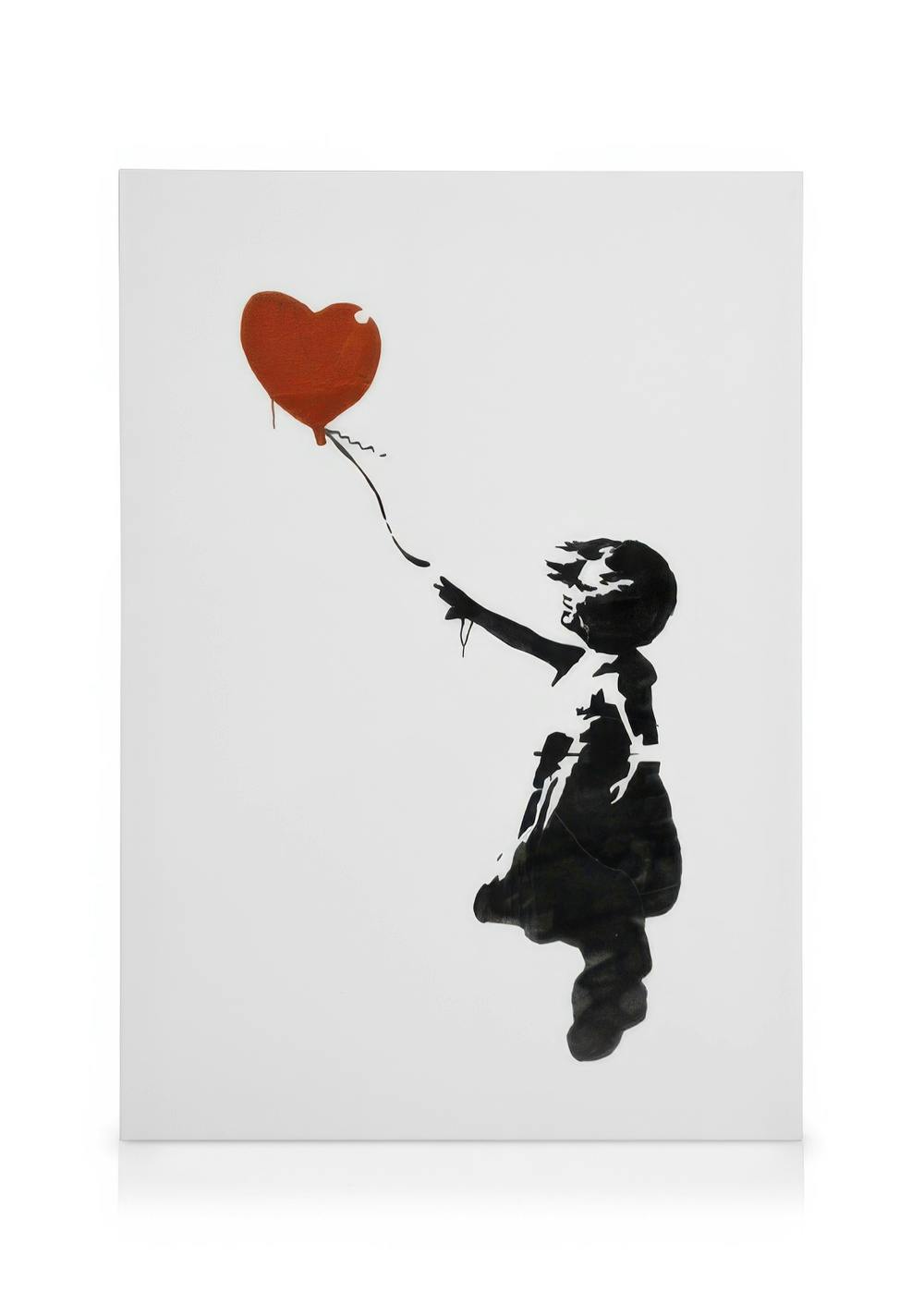 Banksy-style stencil art featuring a young girl reaching for a red heart balloon, black and white with a pop of color