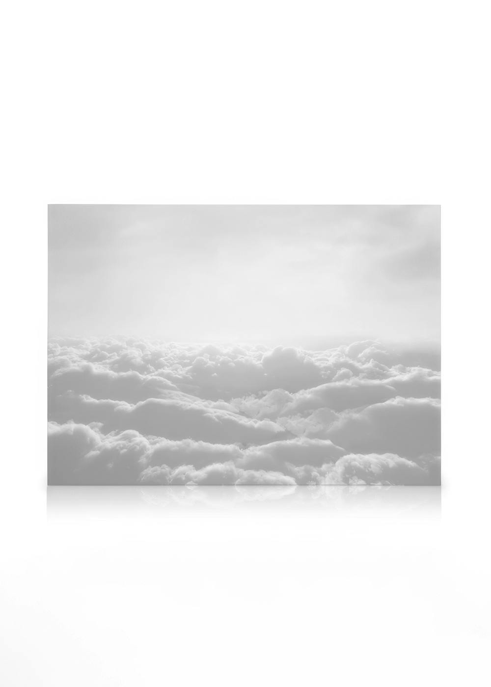 Monochromatic canvas art of fluffy white clouds filling the sky, with a subtle horizon line and soft light from above.