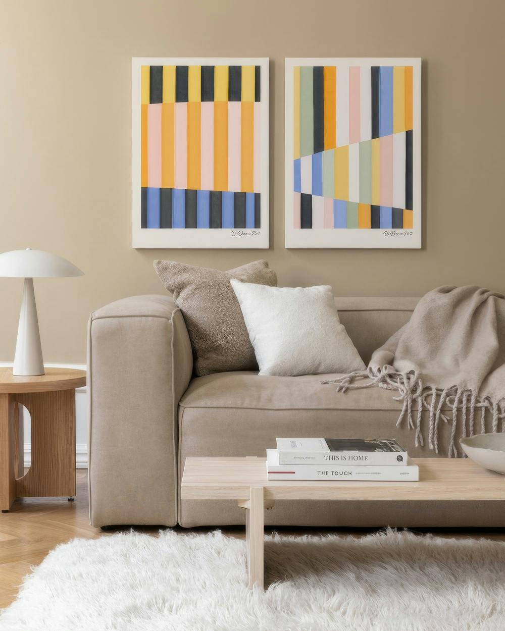 Graphic design canvas duo with abstract orange, black, white, blue, yellow, and pink lines for modern decor.