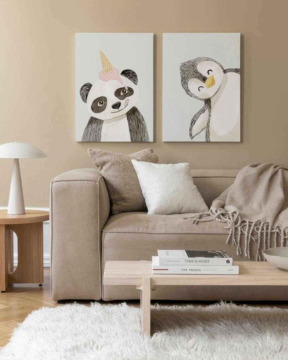 Playful Animal Canvas Duo featuring panda with ice cream and smiling penguin art prints.