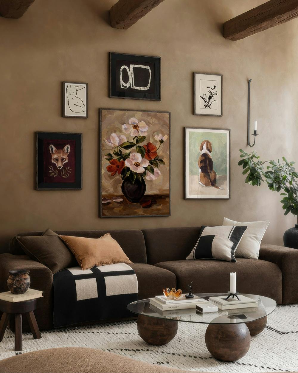 A gallery wall featuring a colorful floral painting, a fox portrait, a dog facing away, abstract shapes, and line art in a livin