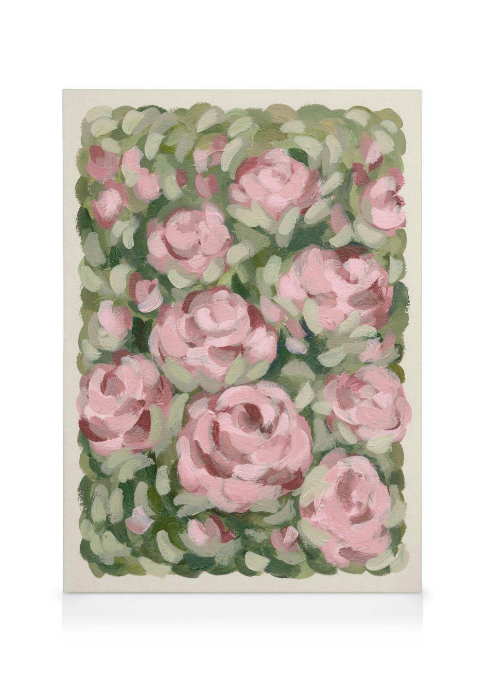 Stampa su tela con un dipinto di rose rosa pastello e boccioli su uno sfondo di foglie verdi.