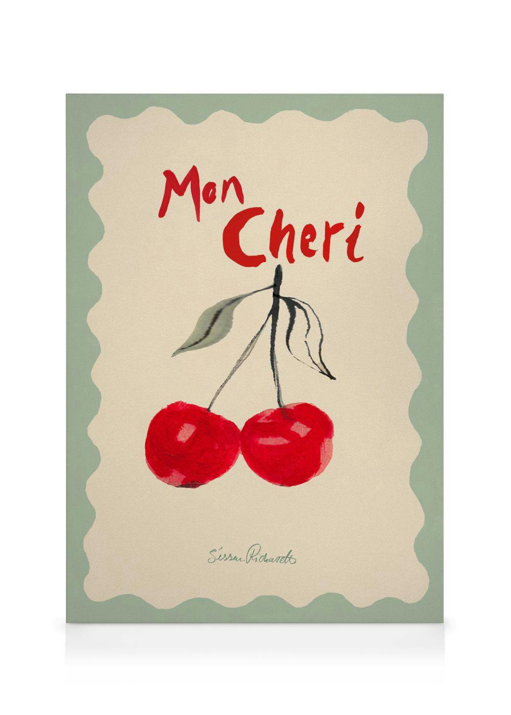 Leinwandbild mit zwei roten Kirschen und dem Schriftzug Mon Cheri auf beigem Hintergrund mit gewelltem Rand.