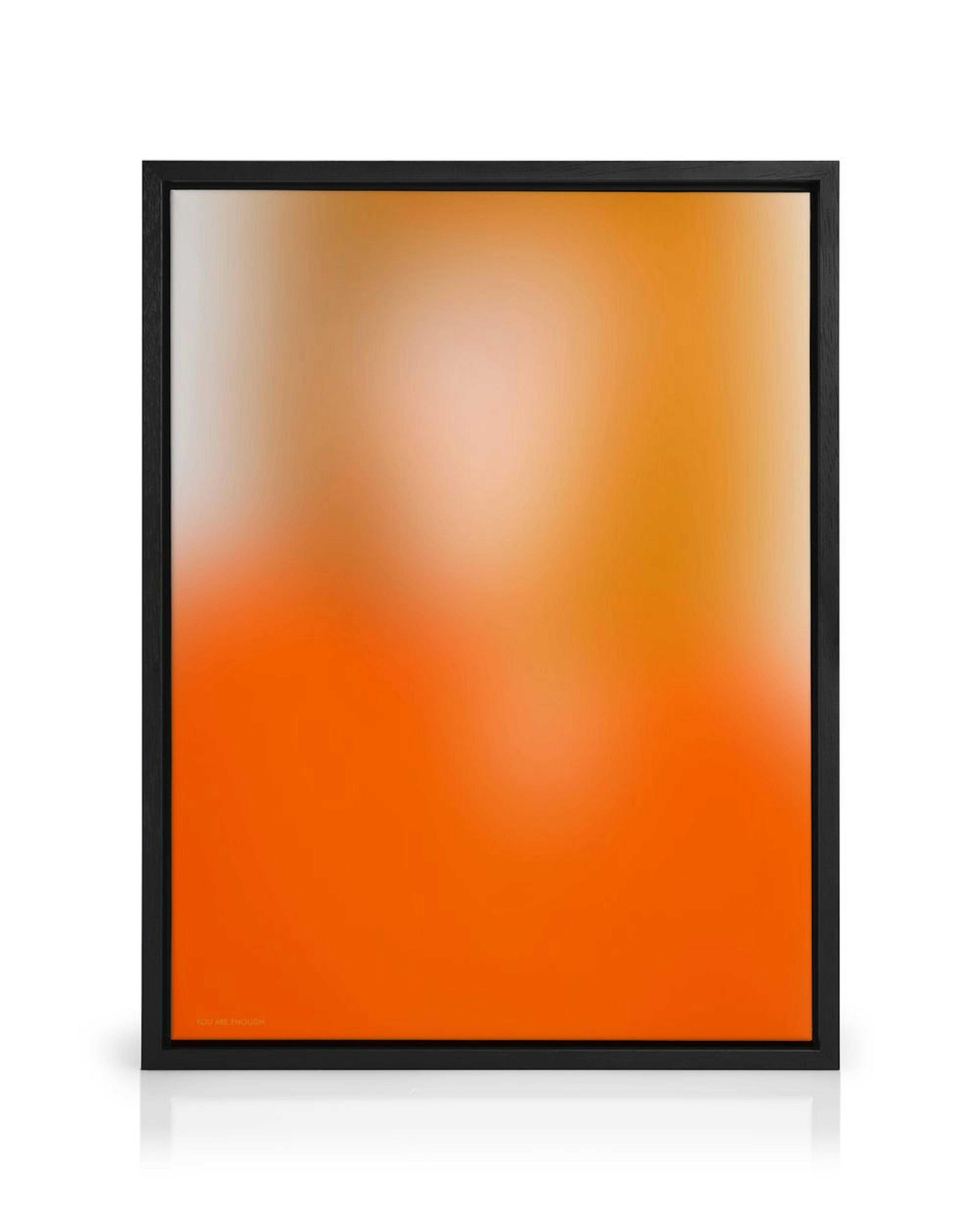 A canvas print featuring a vibrant orange gradient fading to a lighter orange and peach at the top, with YOU ARE ENOUGH text in 
