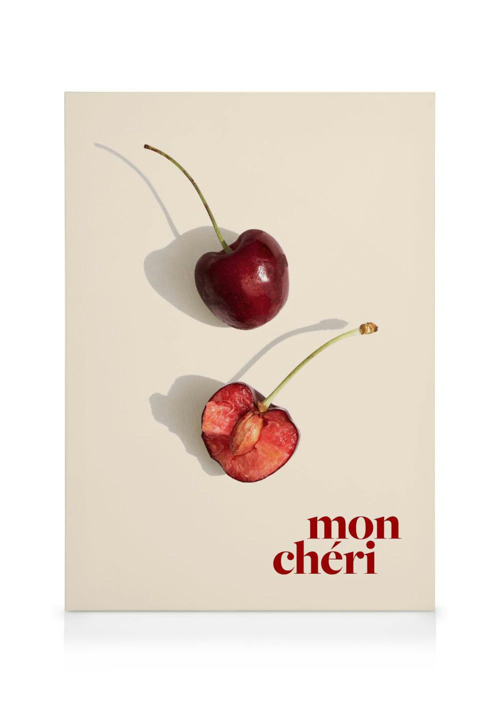 Stampa su tela con due ciliegie rosse su sfondo chiaro, una intera e una tagliata, con la scritta mon chéri.