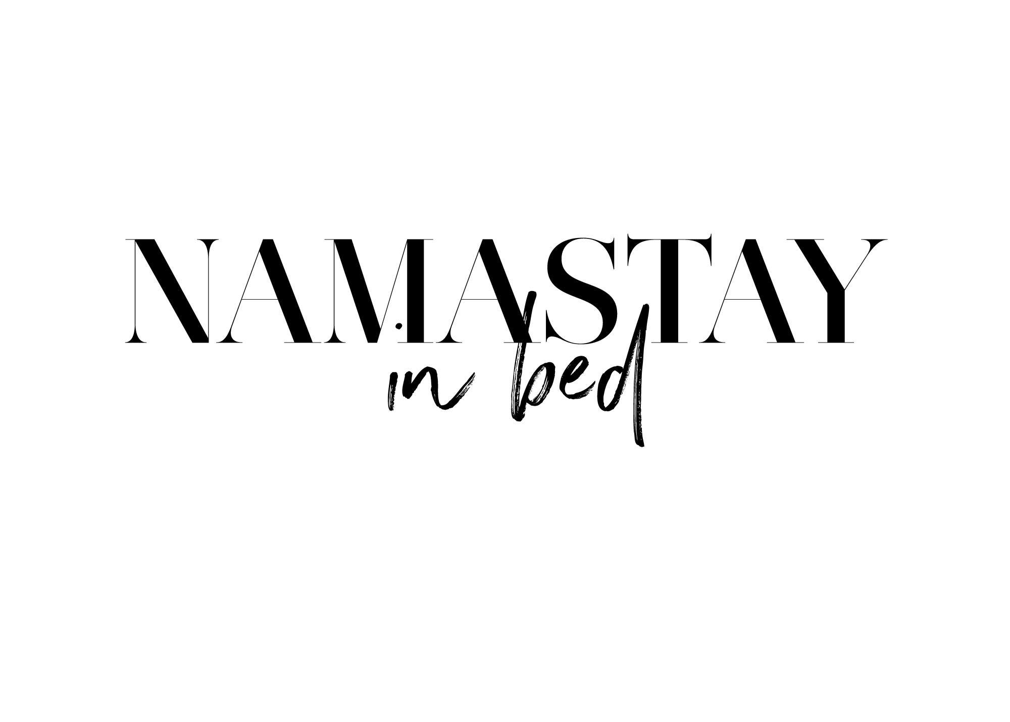 Namastay In Bed poster, black text on white background with Namastay in serif font and in bed in script.