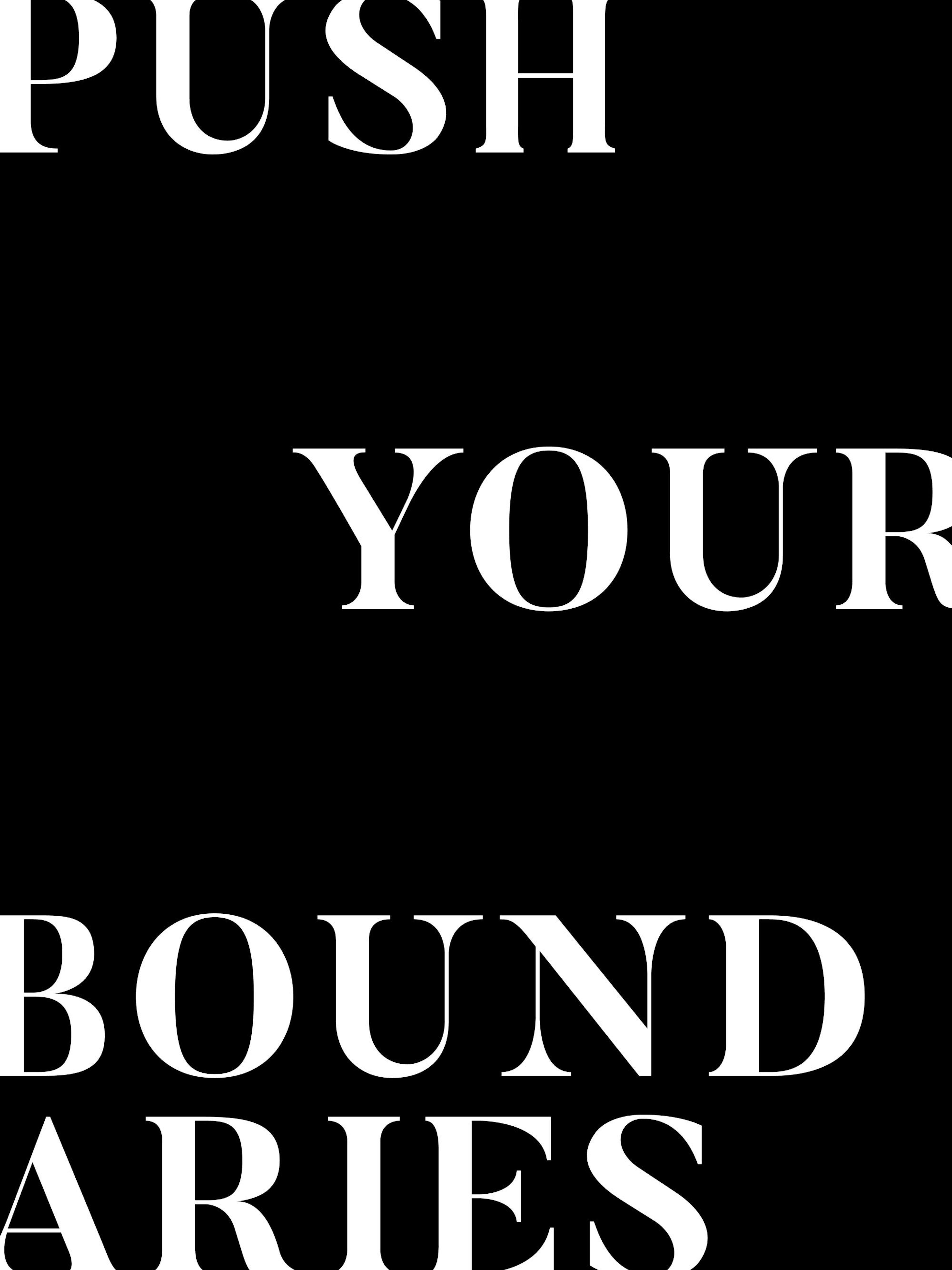 Black and white inspirational poster print with Push Your Boundaries quote in bold white letters on a black background.