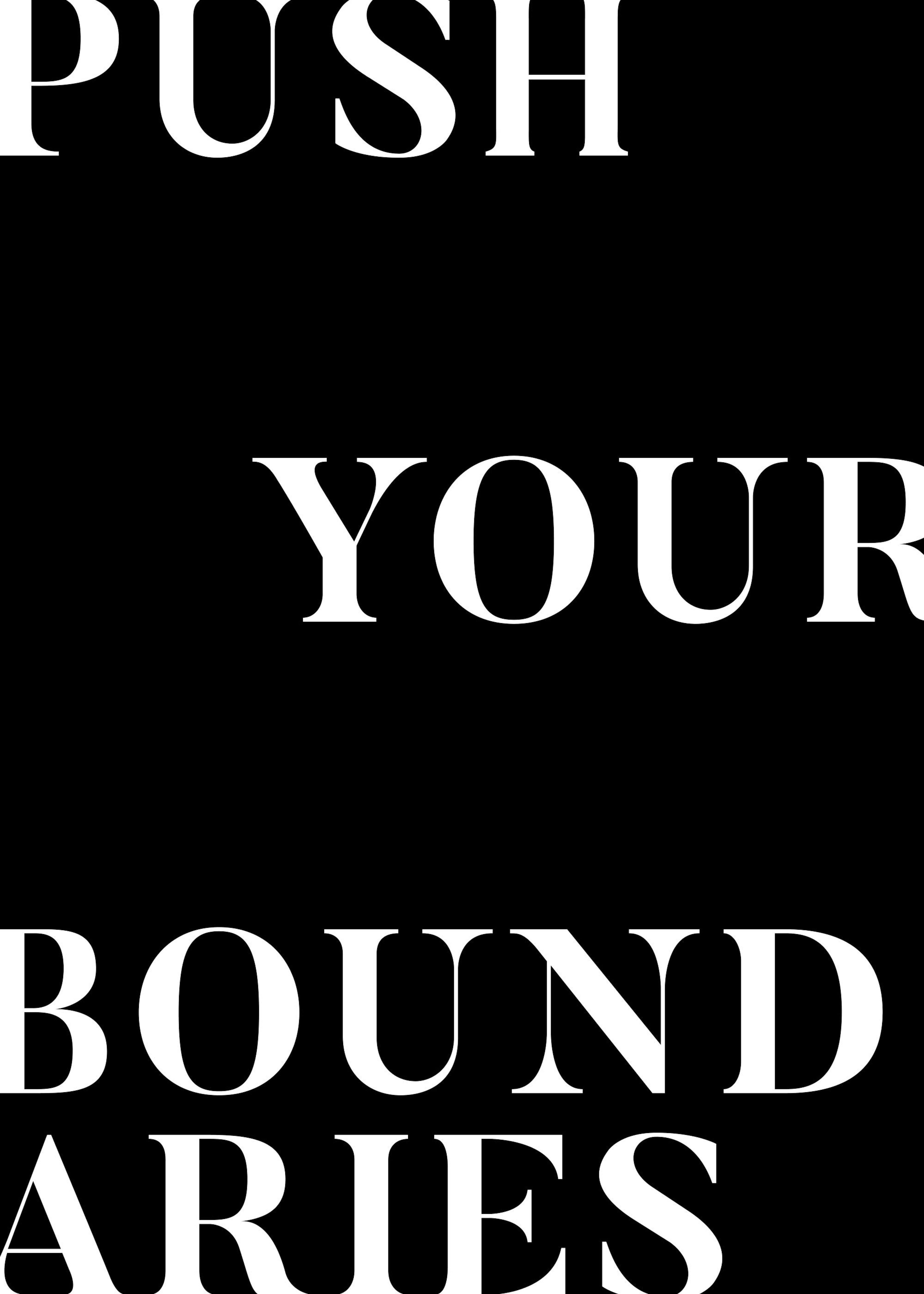 Black and white inspirational poster print with Push Your Boundaries quote in bold white letters on a black background.