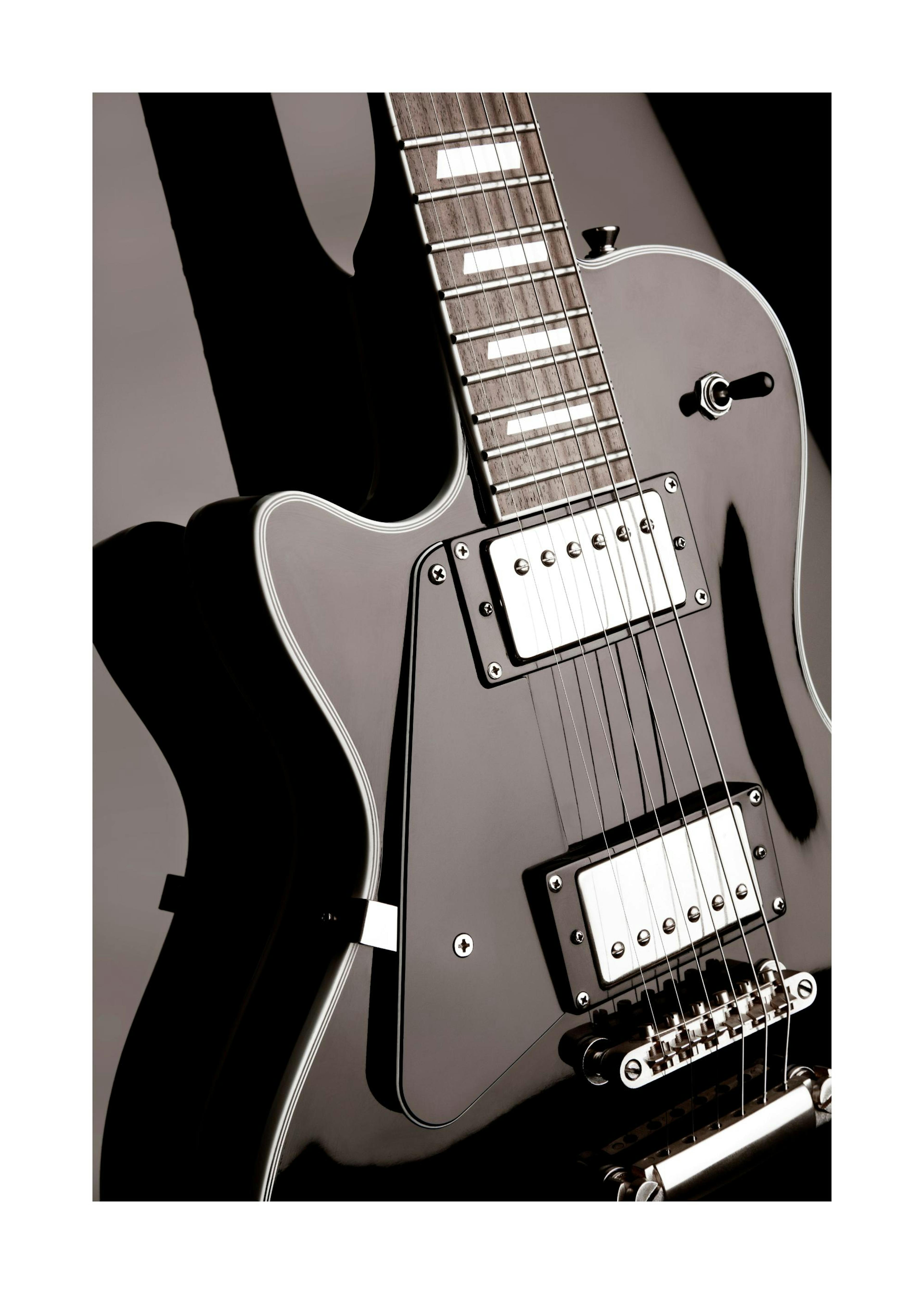 Black electric guitar close-up print, showcasing strings, fretboard, and body details in a poster format.