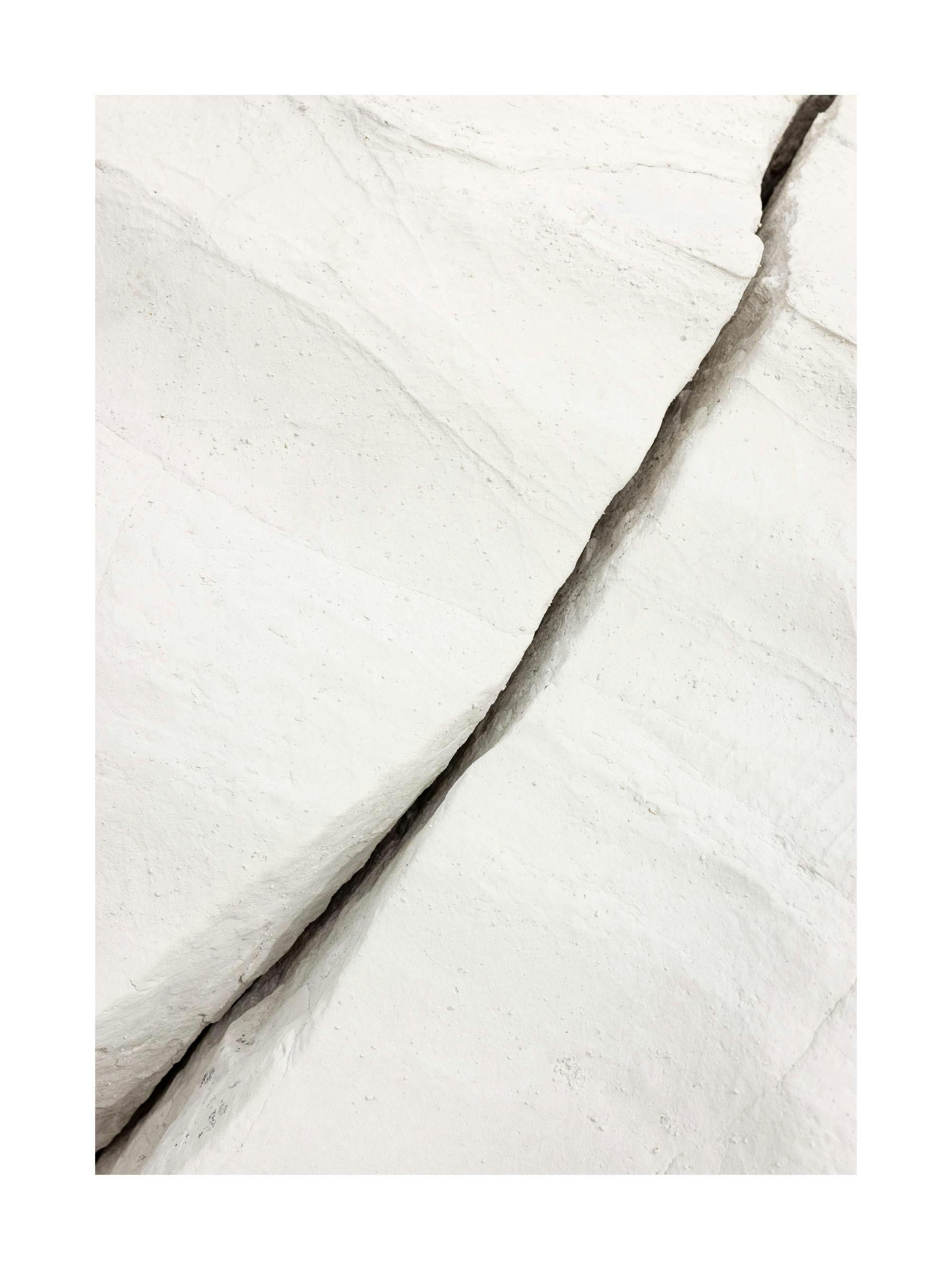 White rock crevice print with dark shadow, natural geological formation, abstract nature poster.