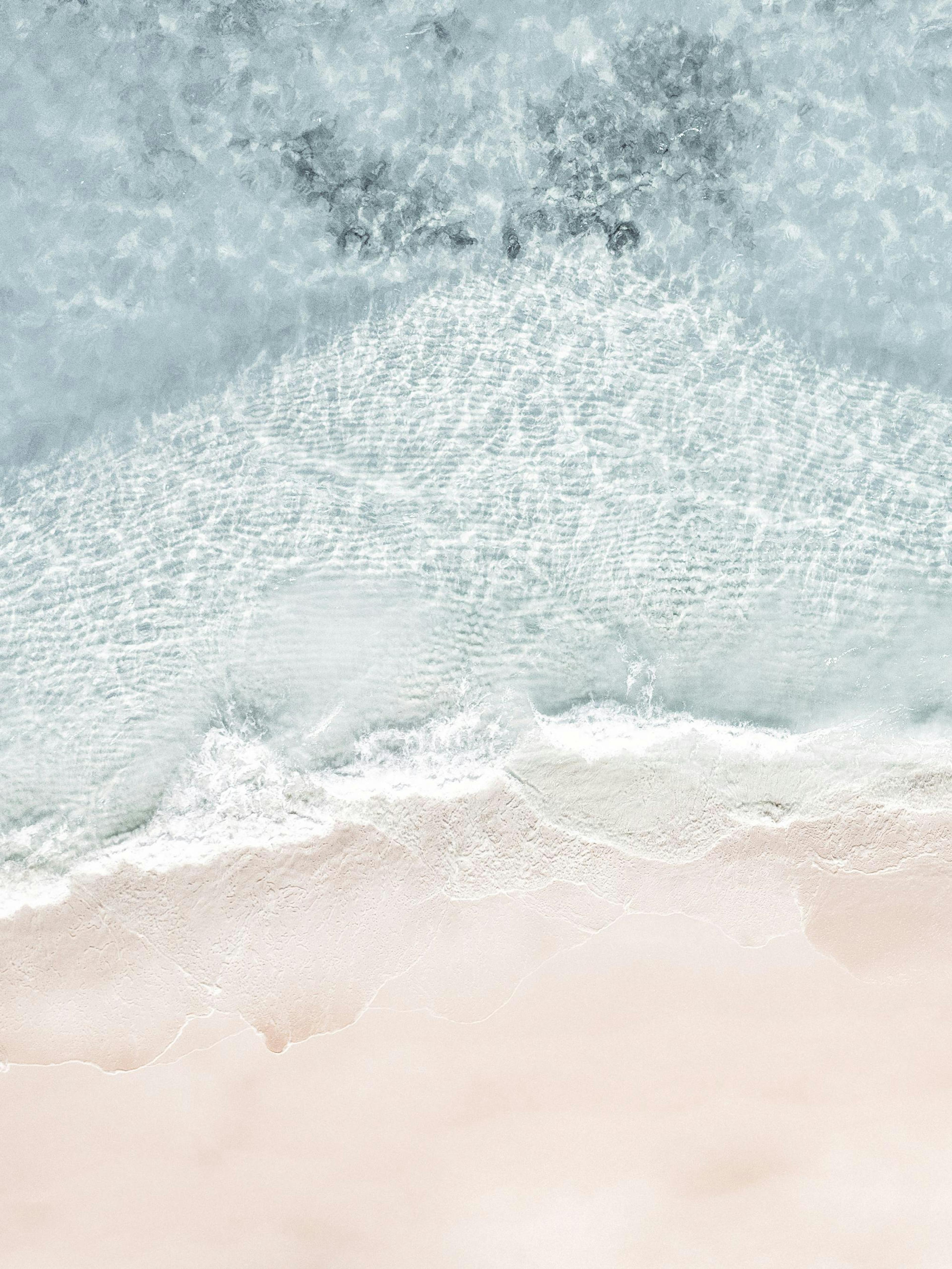 Seascape print of ocean waves crashing onto a sandy beach, a beautiful poster of the sea.