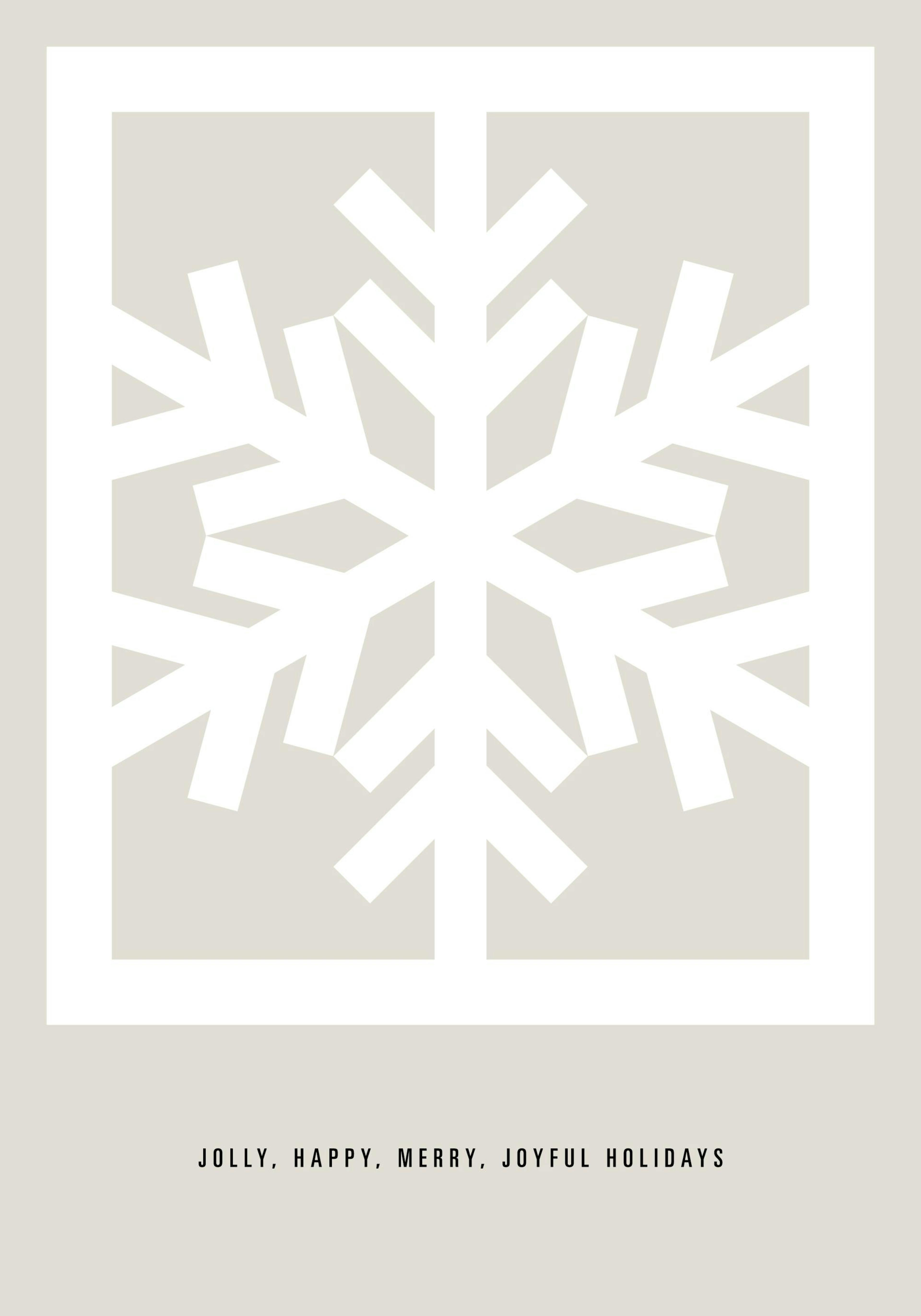 A holiday print with a white geometric snowflake on a beige background, hanging above a table with candles and cake.