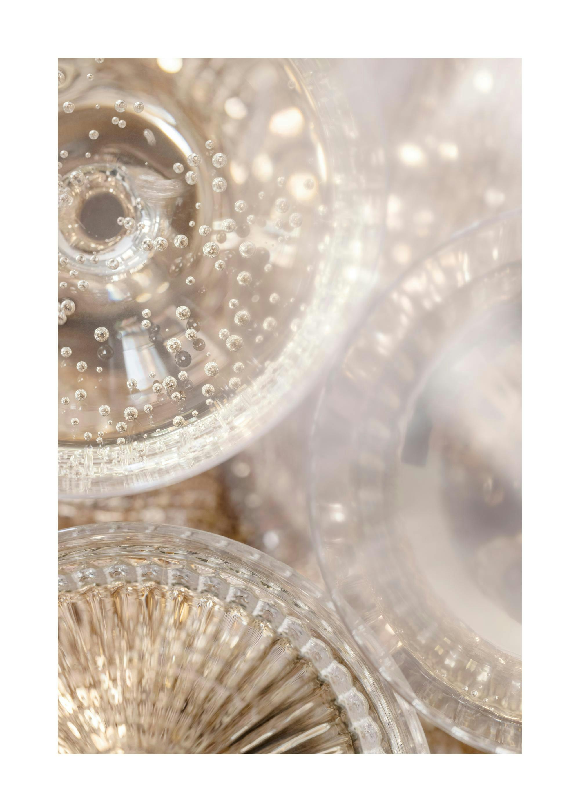 Close-up photo of champagne glasses filled with bubbly drinks, perfect for celebrations.