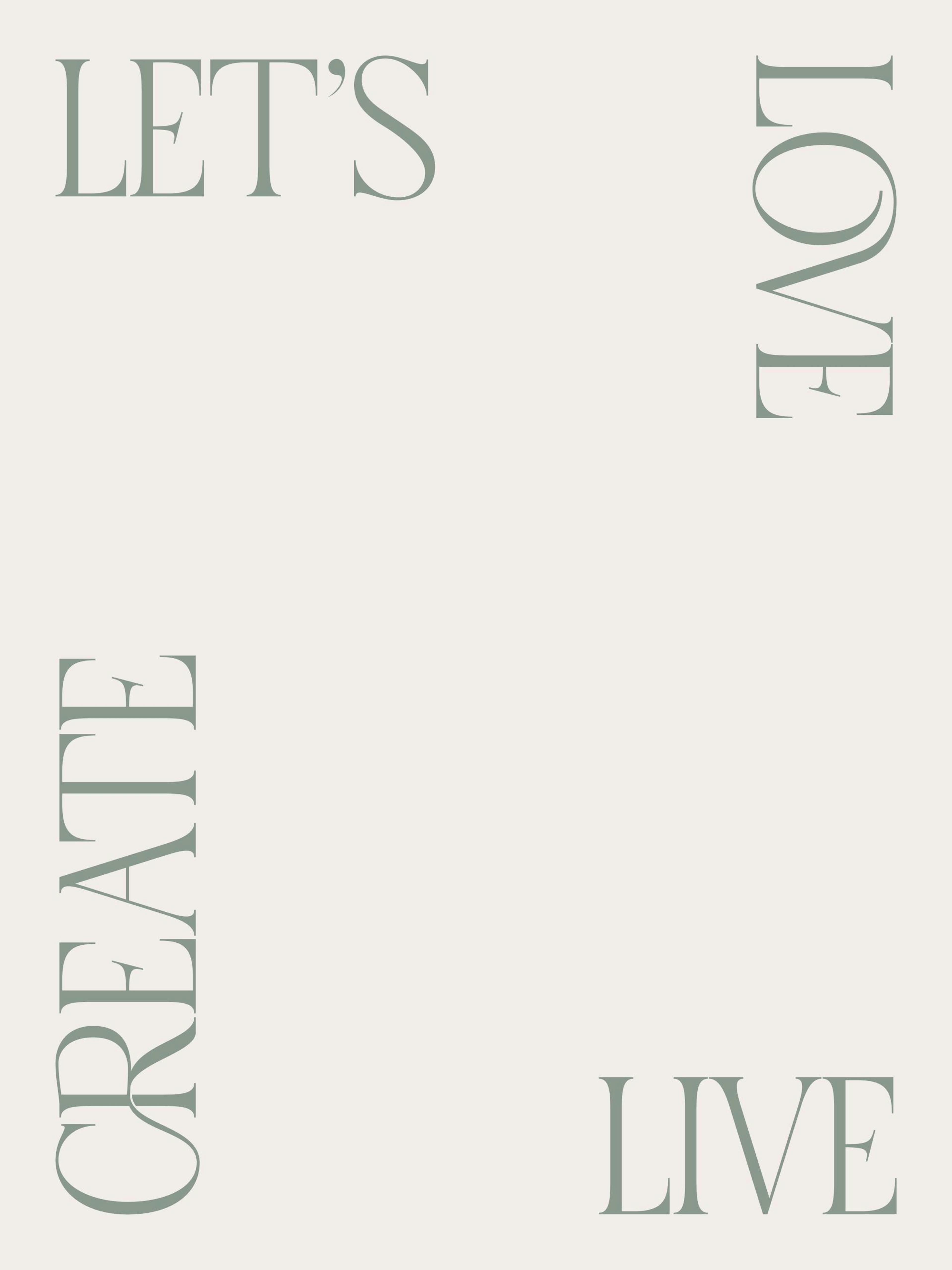 A print with LETS CREATE LOVE LIVE text, in a kitchen with a coffee machine and wooden cutting boards.