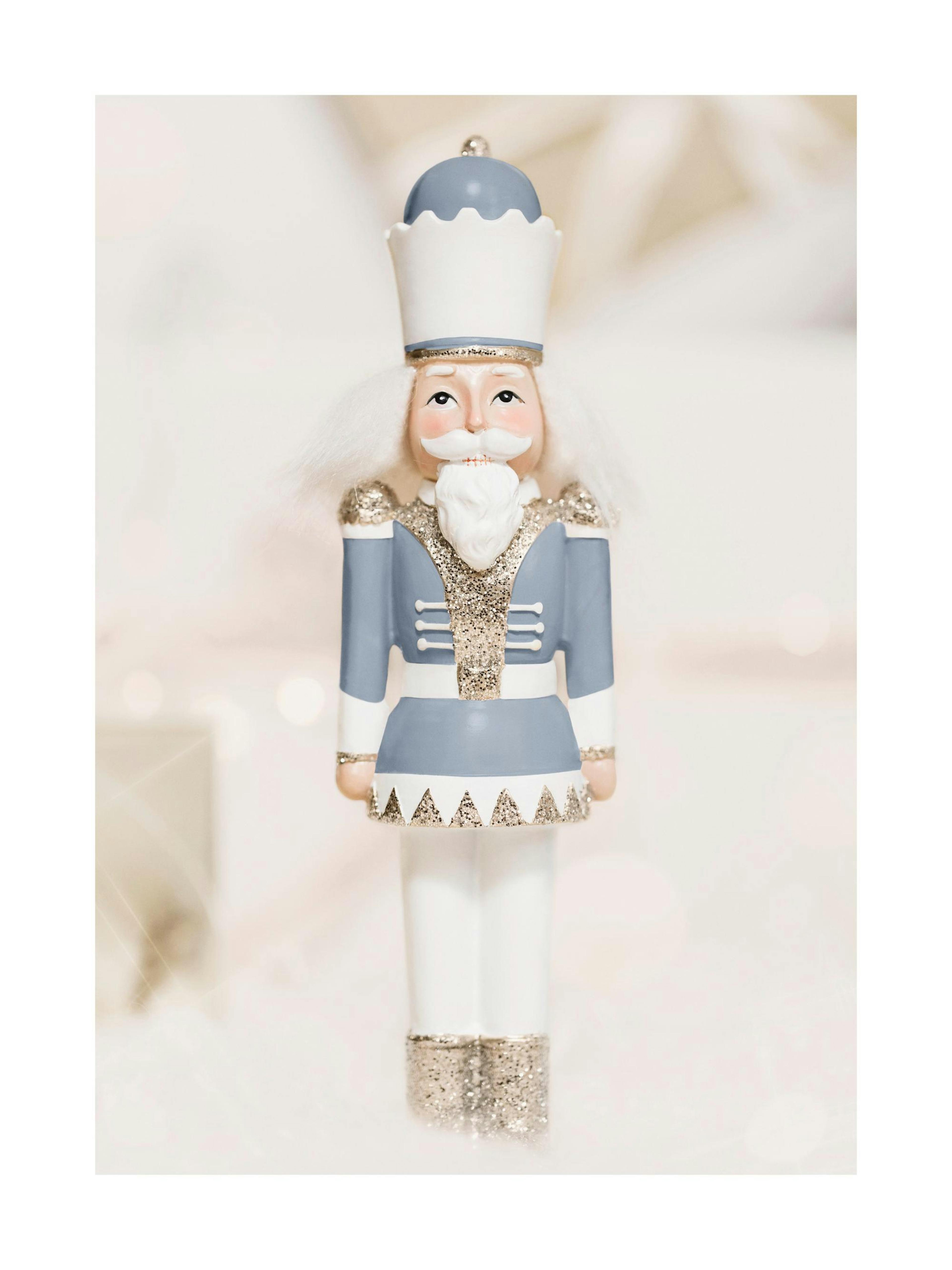 Holy Nutcracker print with pastel blue and beige tones, holiday poster
