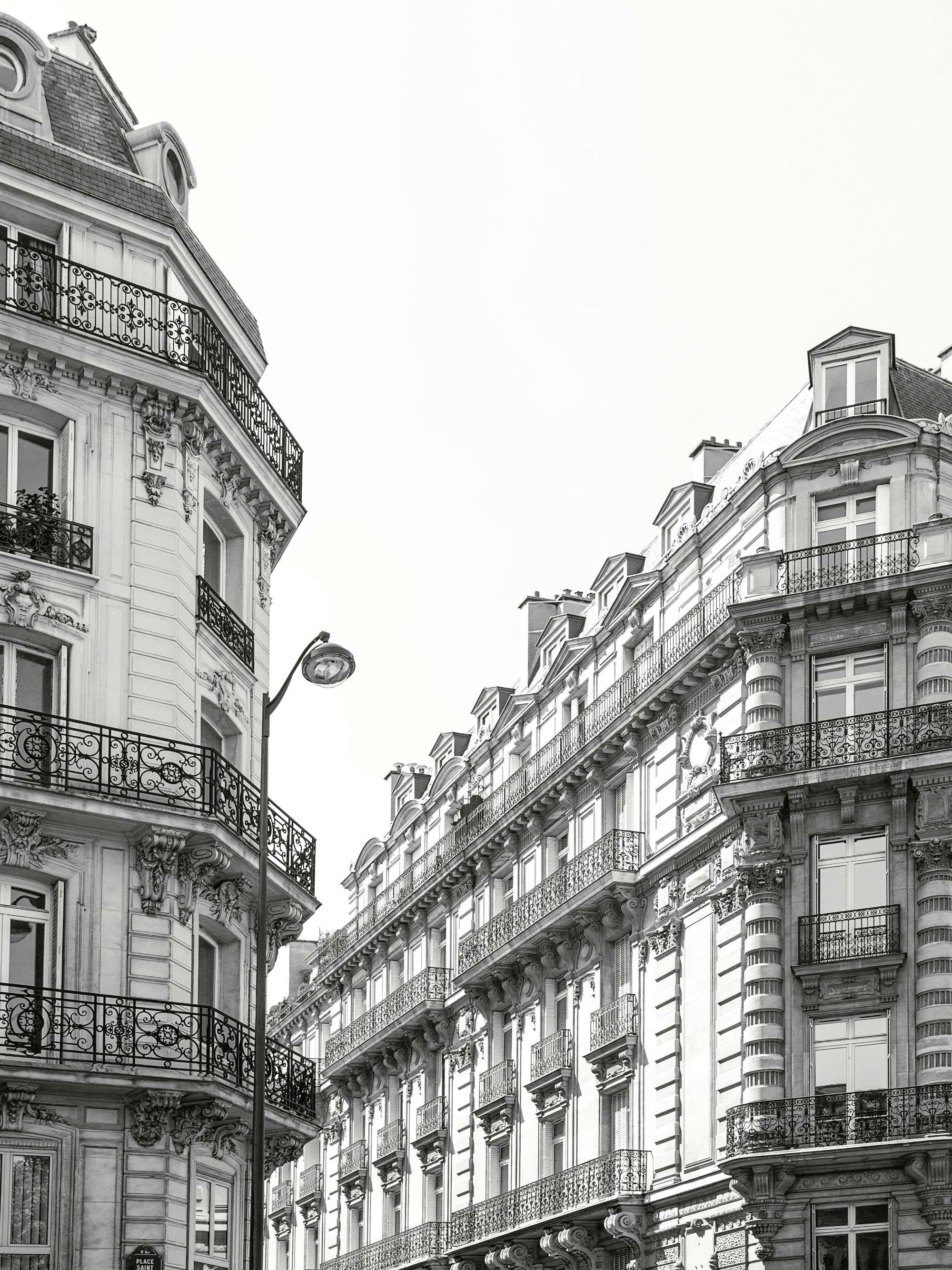 Monochrome Paris architecture print, black and white photo of ornate buildings, street lamp, and balconies.