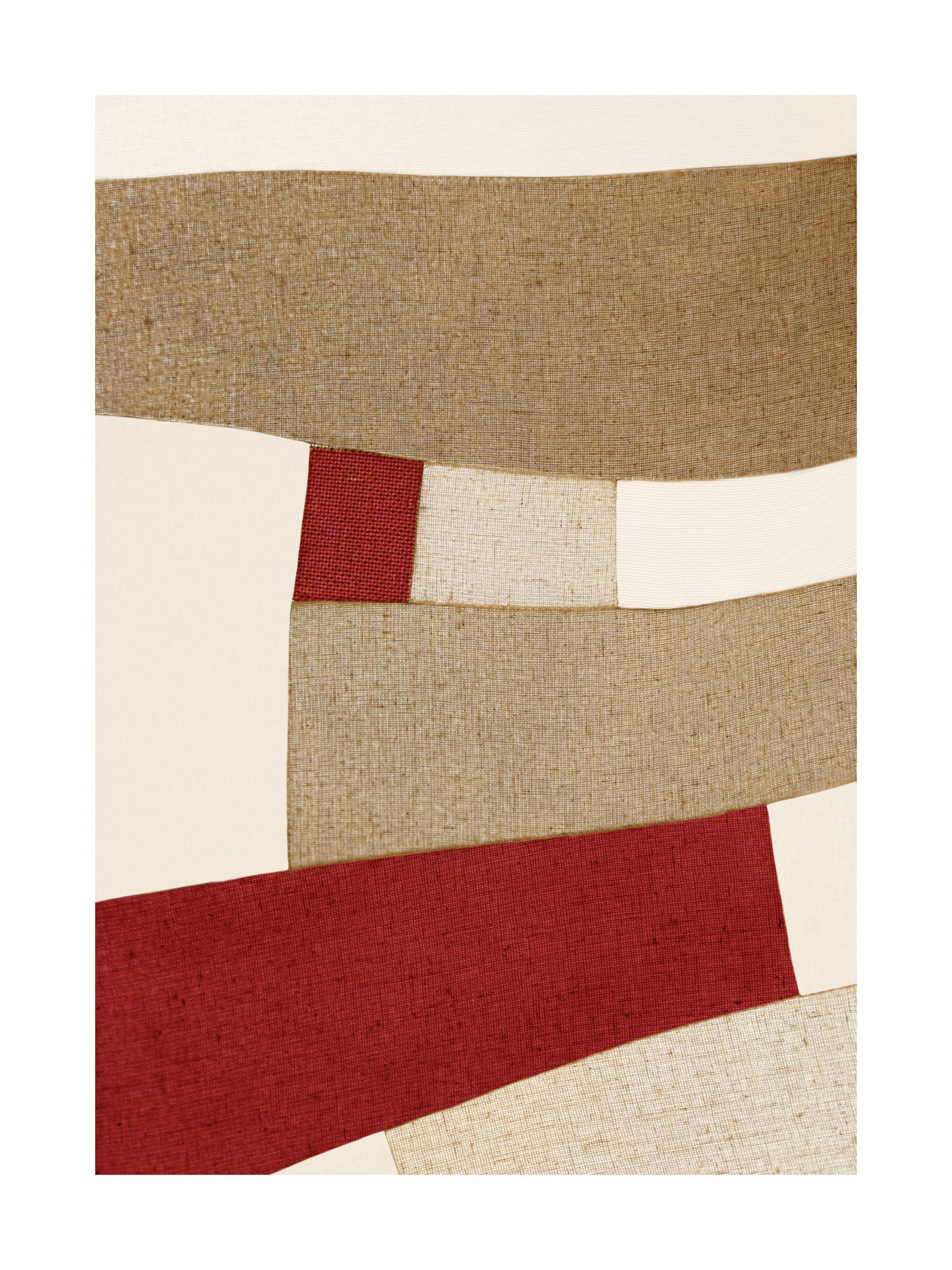 Red and beige patchwork print with textured fabric-like stripes, a unique abstract poster design.