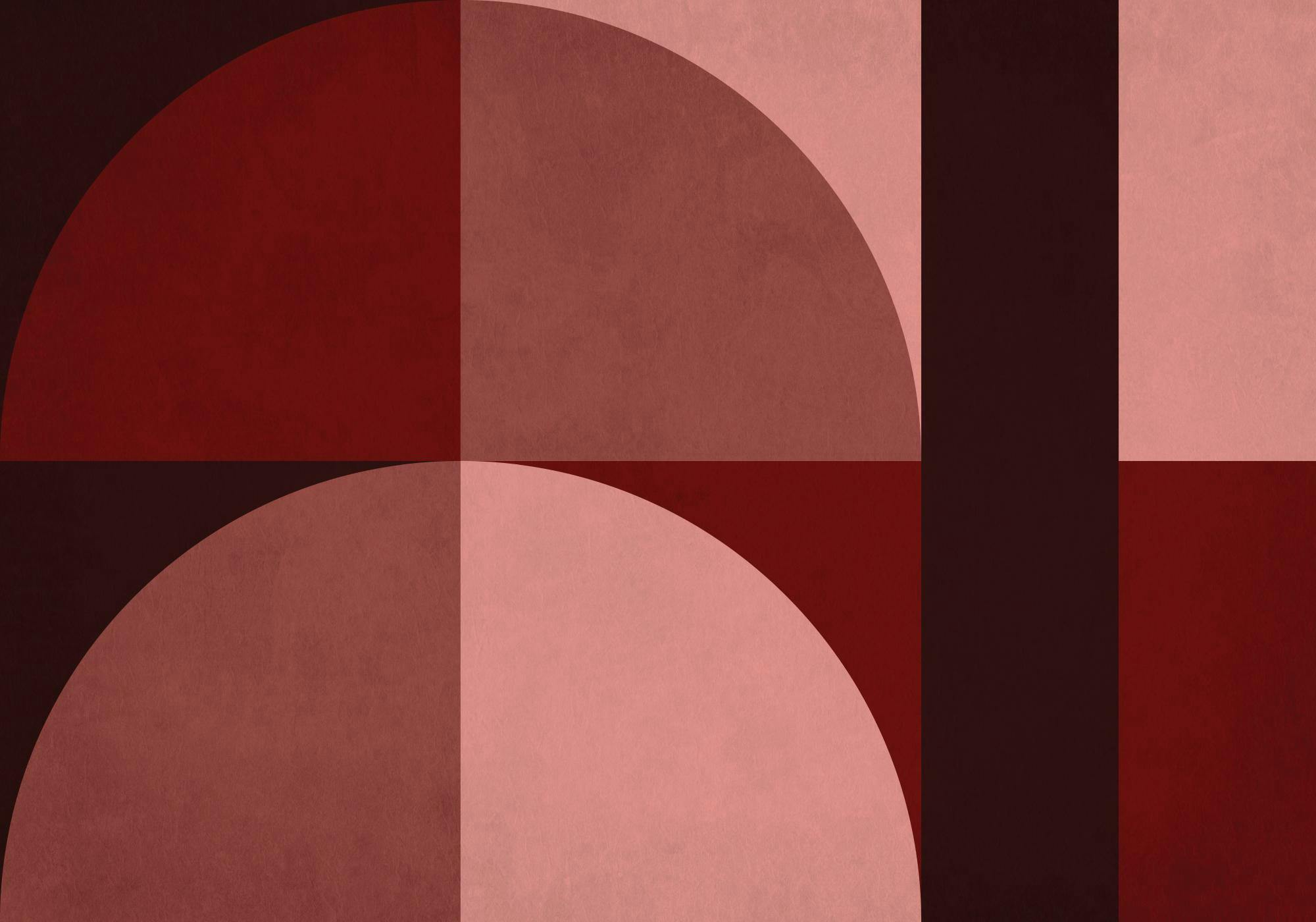 Poster geometrico con blocchi di colore rosso scuro e rosa, mezzelune e rettangoli testurizzati.