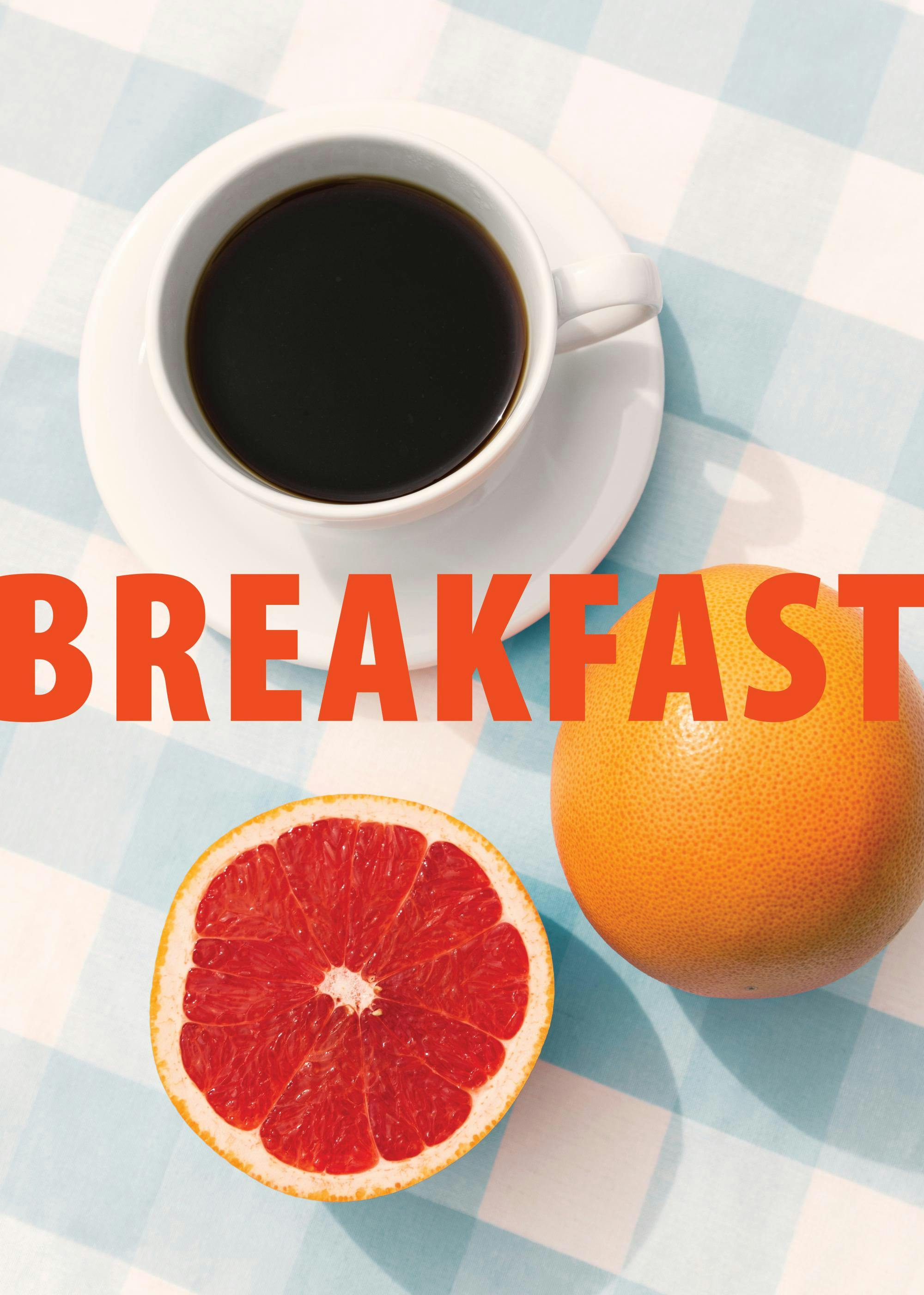 Breakfast print with a full coffee cup, whole grapefruit, and a grapefruit half on a blue gingham tablecloth.