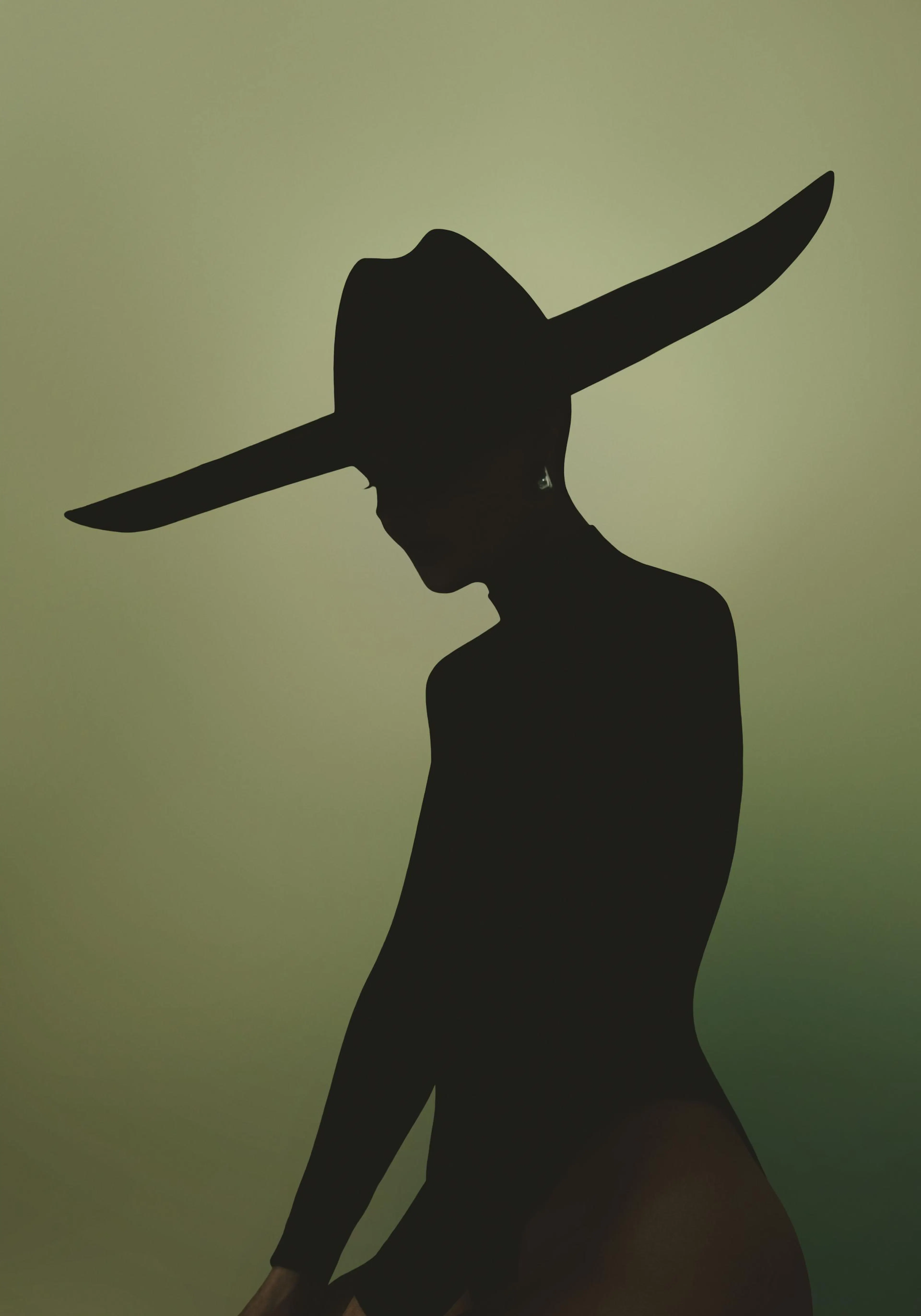 A black silhouette print of a person wearing a wide-brimmed cowboy hat and an earring, against a green background.