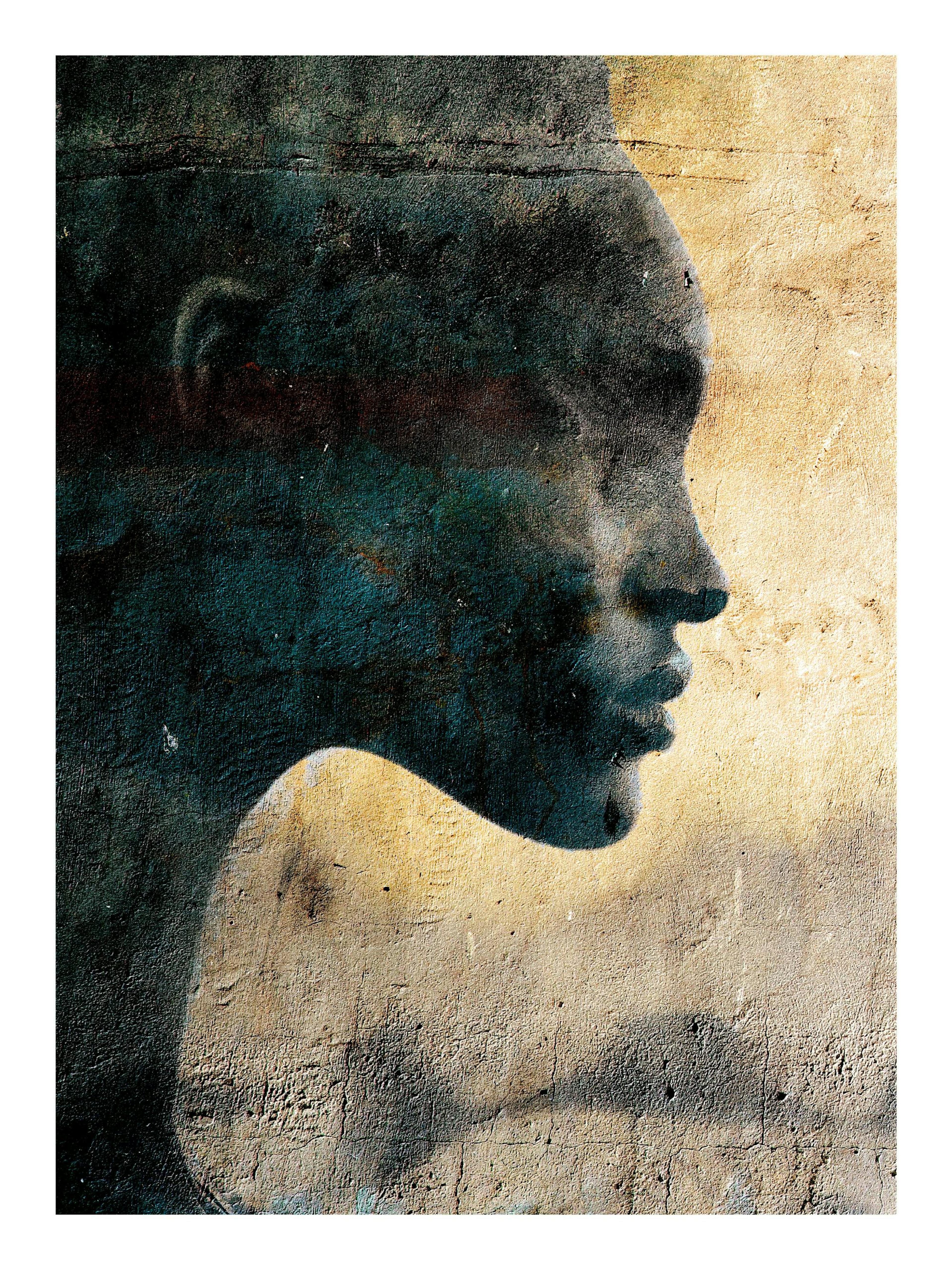 Profile of a womans face on a smudgy teal, yellow, and beige poster print by Linnea Frank.
