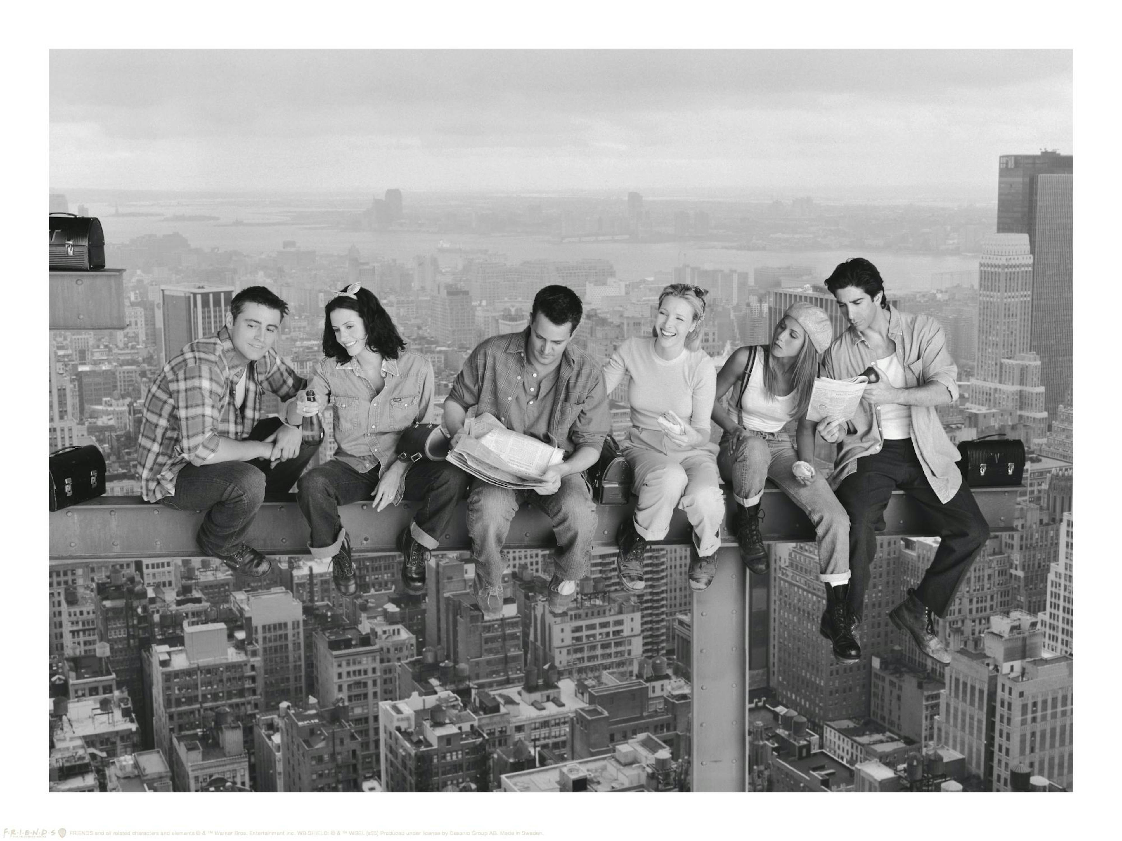 Black and white Friends cast lunching on skyscraper beam, iconic TV show poster, New York City skyline in background.