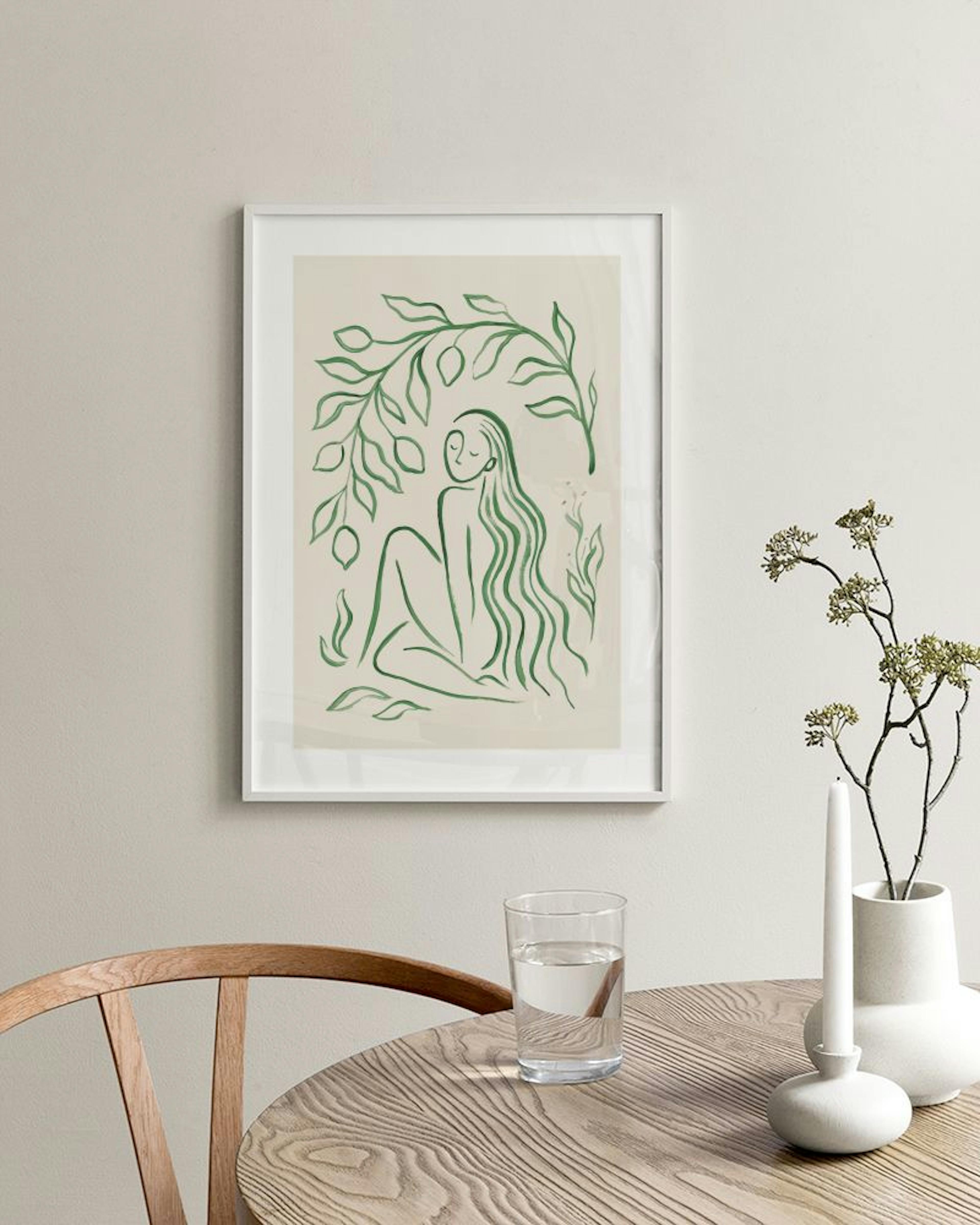 Poster mit grüner, sitzender Frauenfigur und Blättern, über einem weißen Sideboard mit Vase und Buch.
