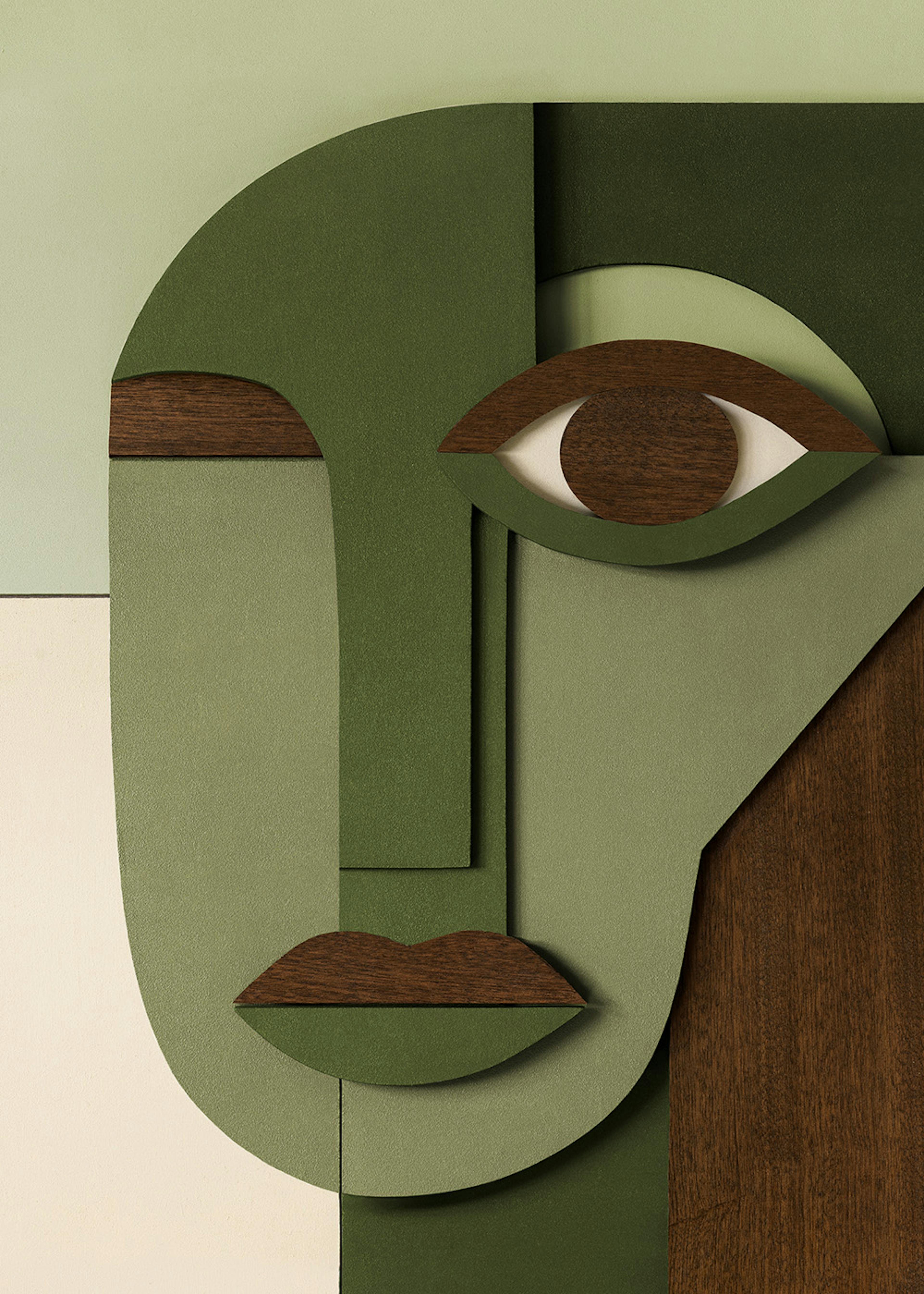 A print of an abstract face in shades of green with dark wood accents for features like the eye, nose, and lips.