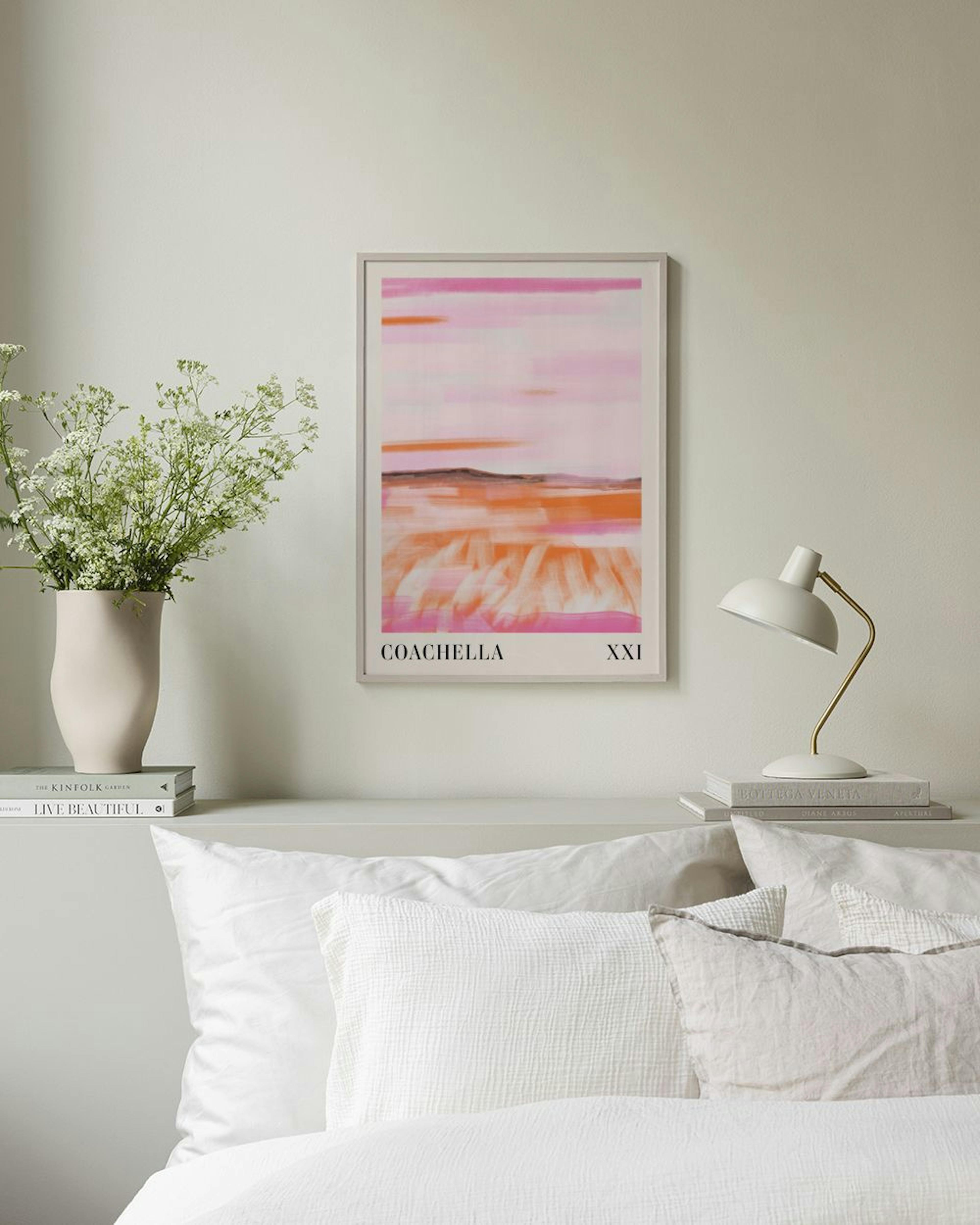 A Coachella poster with pink and orange brushstrokes hangs above a white cabinet with decorative vases and a book.