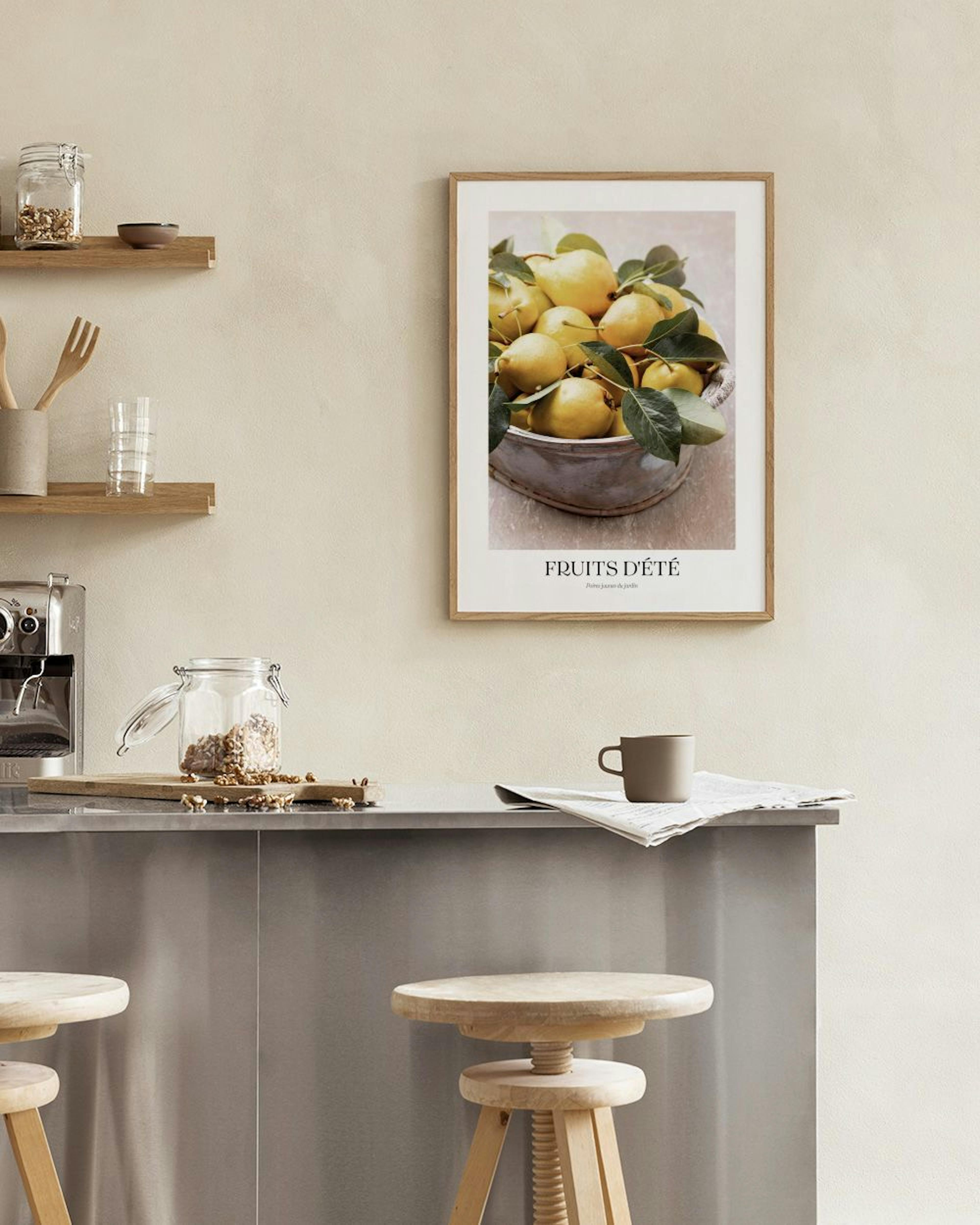 A print of yellow pears with green leaves in a bowl, hanging above a white console table with cups and bottles.
