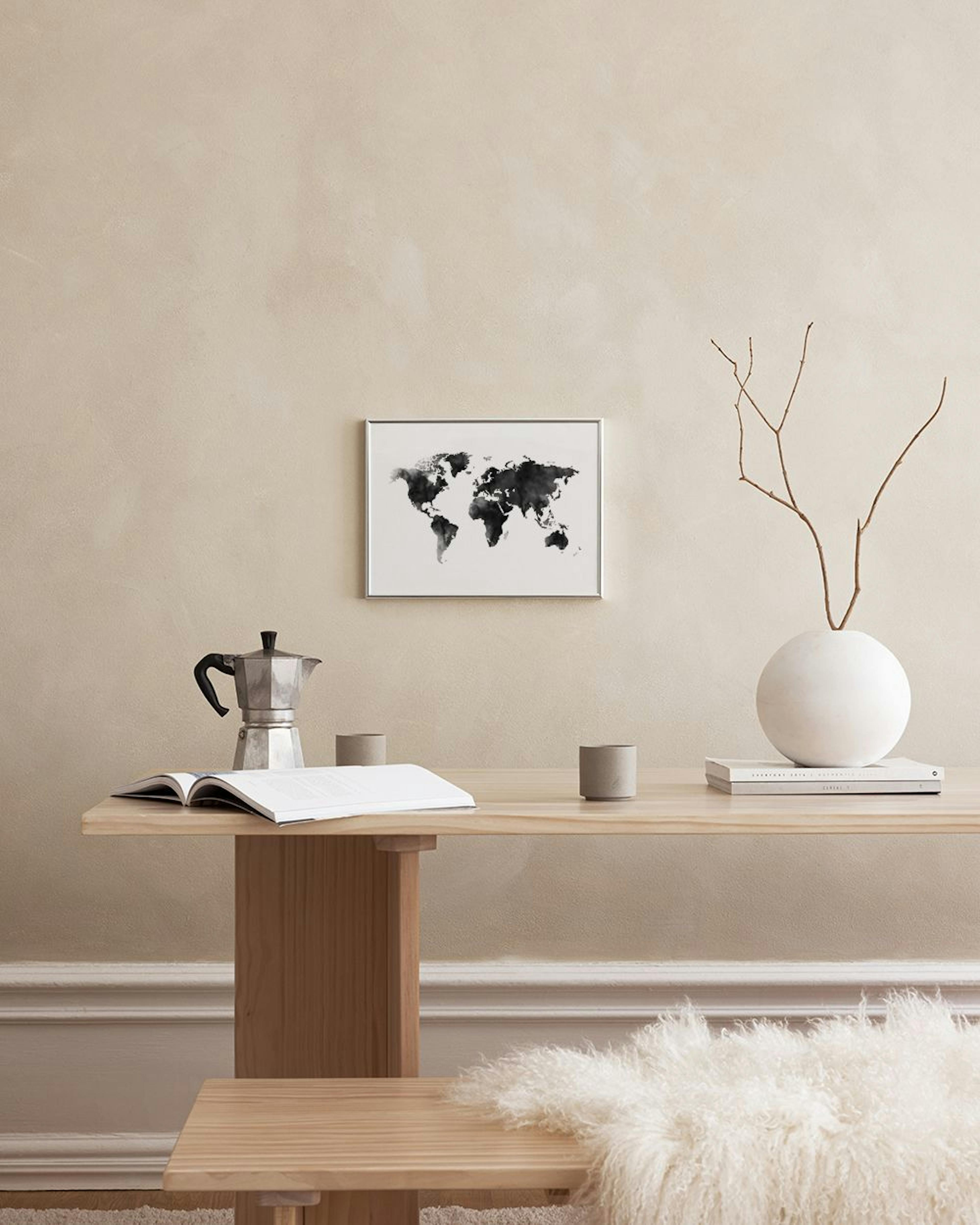 A watercolor world map print with black landmasses on a white background, hanging above a black console table in a teal room.
