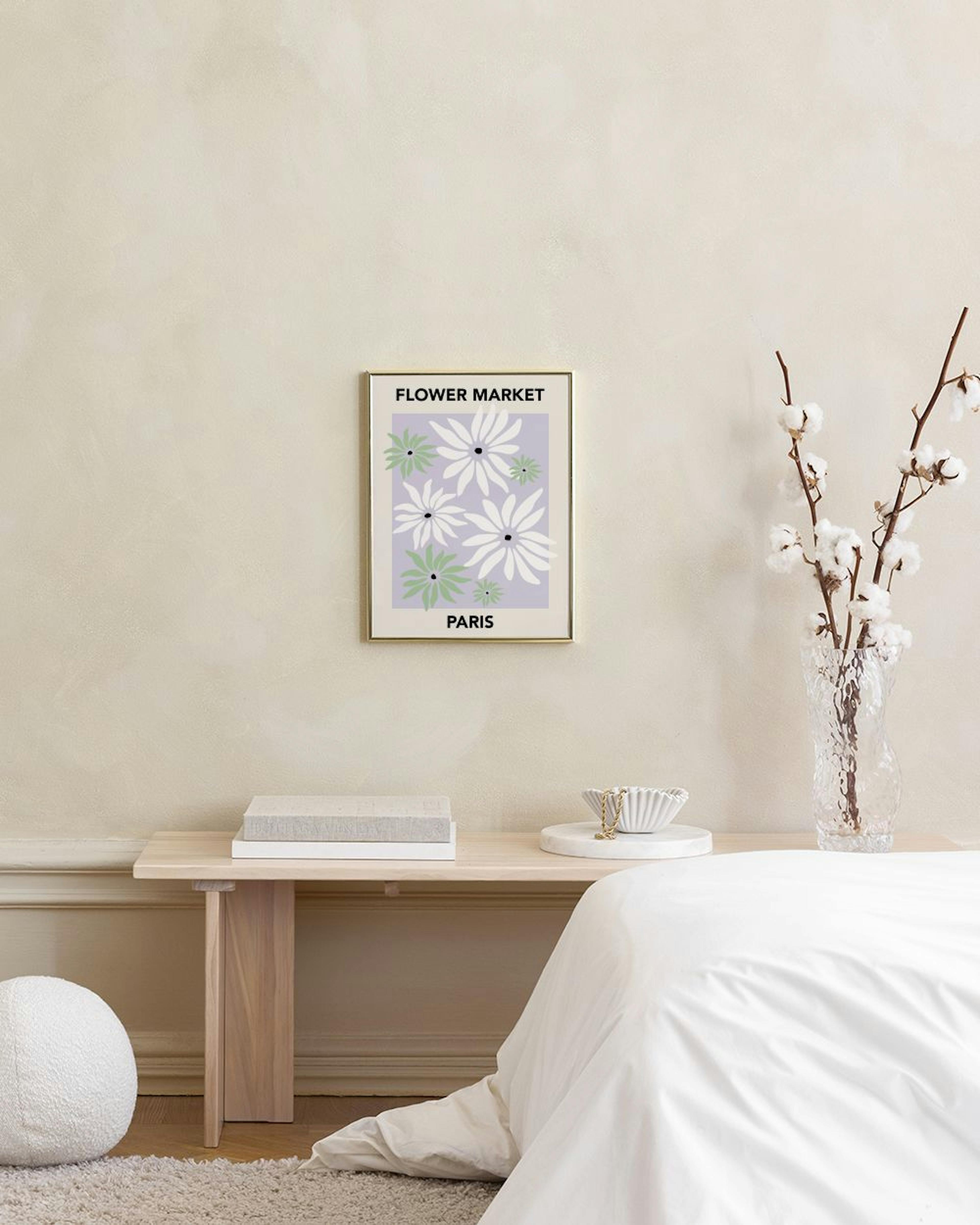 A Flower Market Paris print with white and green daisies on a lilac background, hanging above a mint green sofa.
