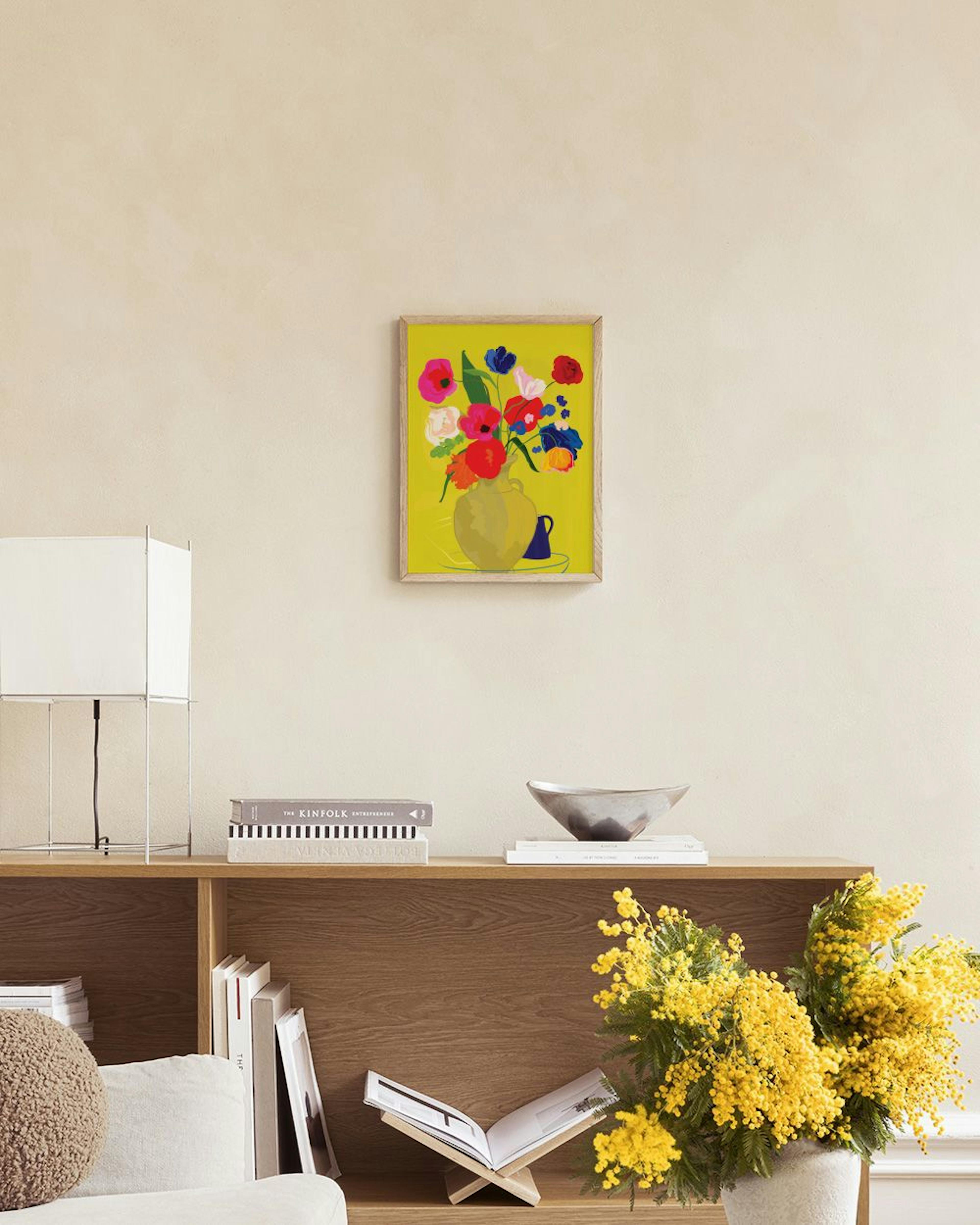Vibrant floral print with red, pink, blue, and orange flowers in a yellow vase on a bright yellow background, hanging in a moder