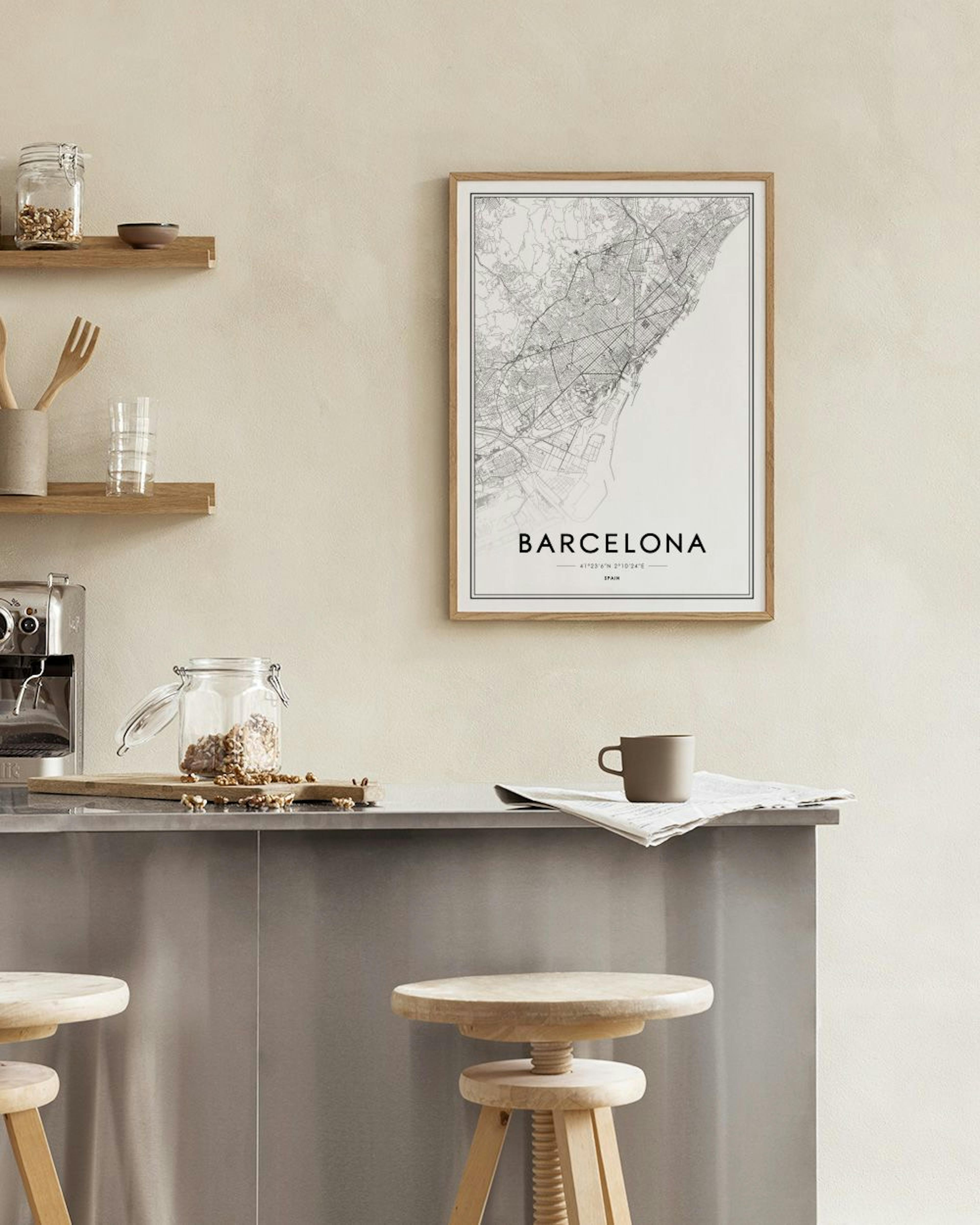 Affiche de carte de Barcelone en noir et blanc, accrochée au-dessus dune console noire avec sabliers et bougeoirs dorés, dans un