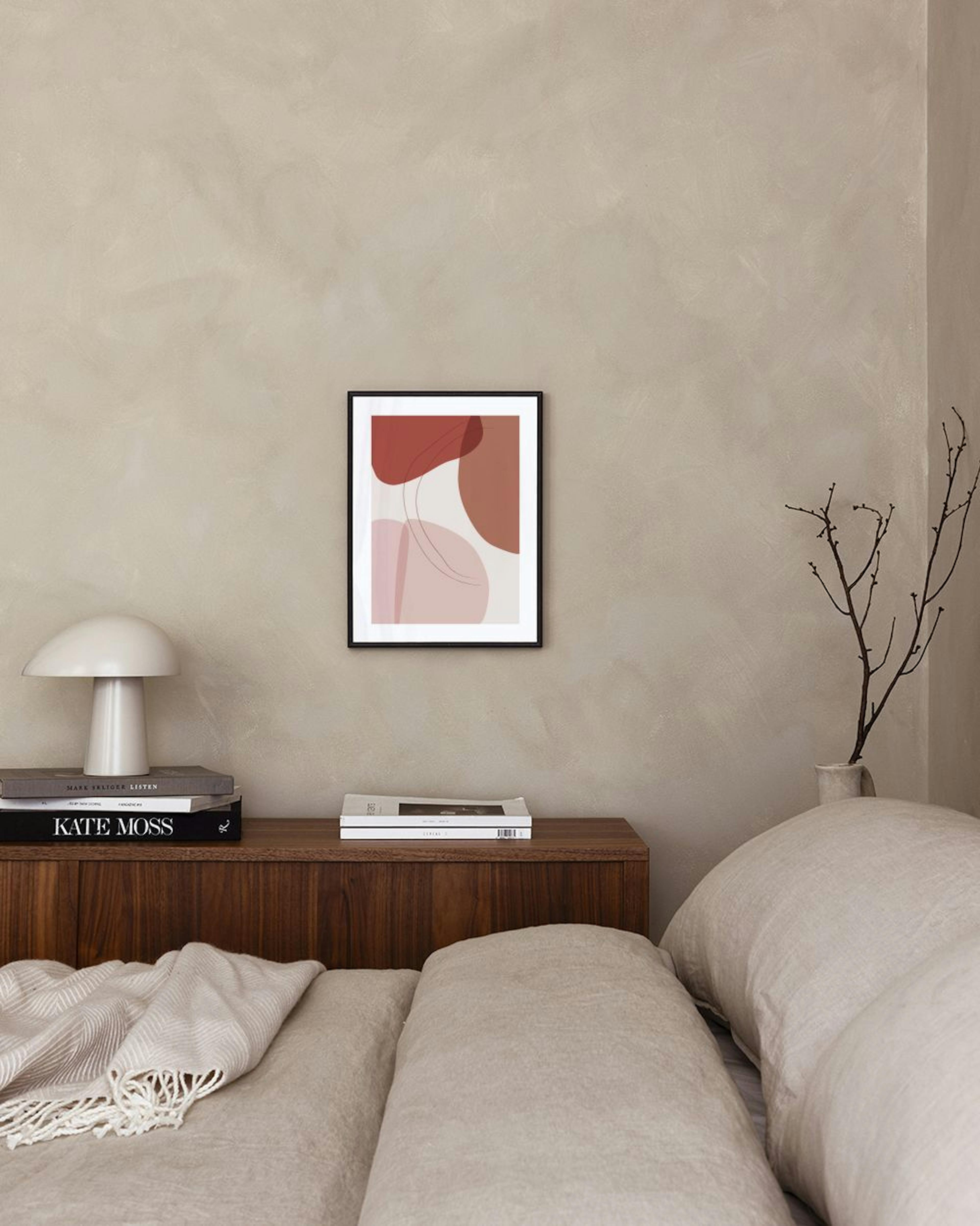 Abstract print with organic shapes in rust, brown, and light pink, with delicate lines, hanging in a bright room with a brown ve