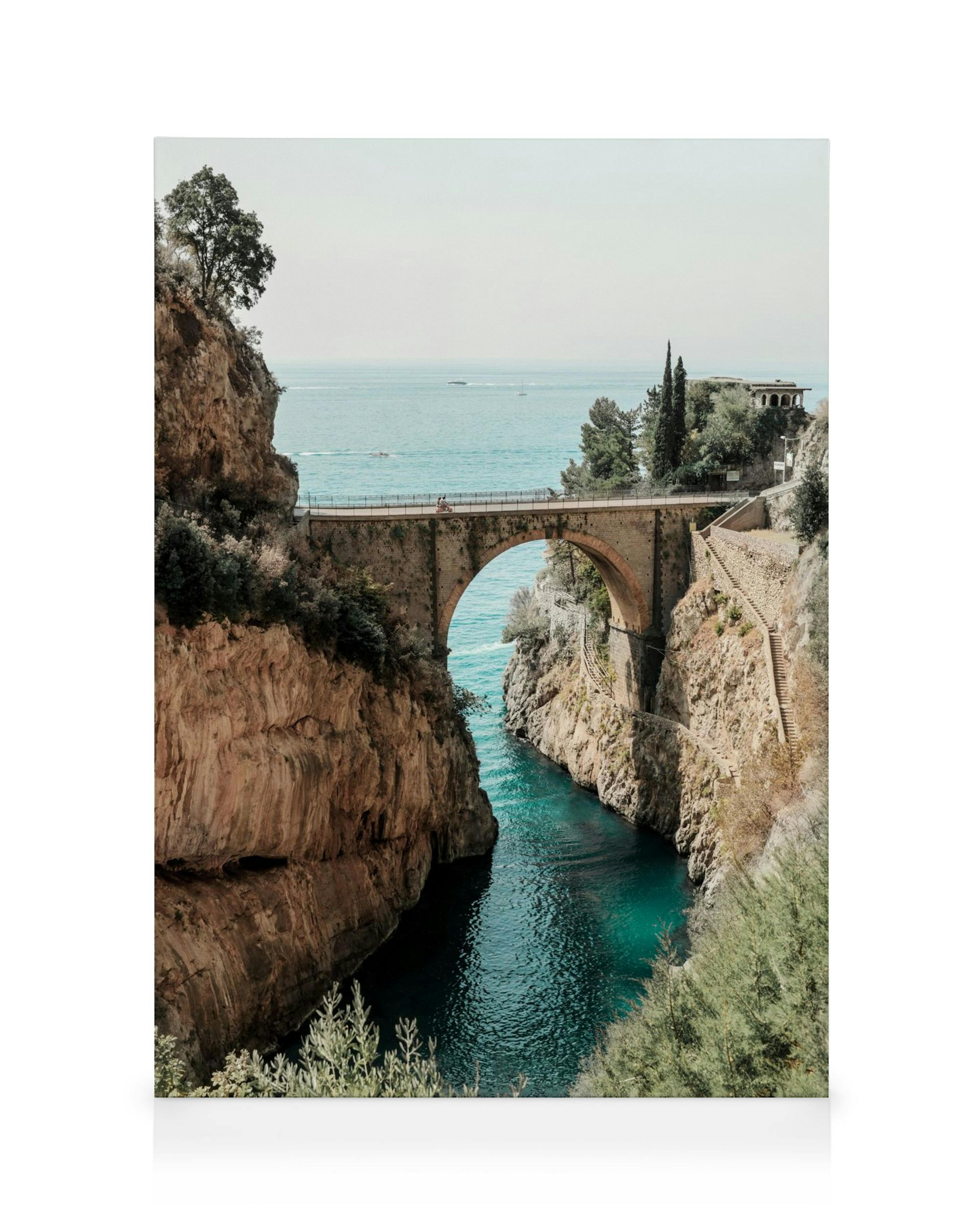 Fiordo di Furore canvas print, featuring an arched bridge over turquoise water between rocky cliffs; Italy wall art.