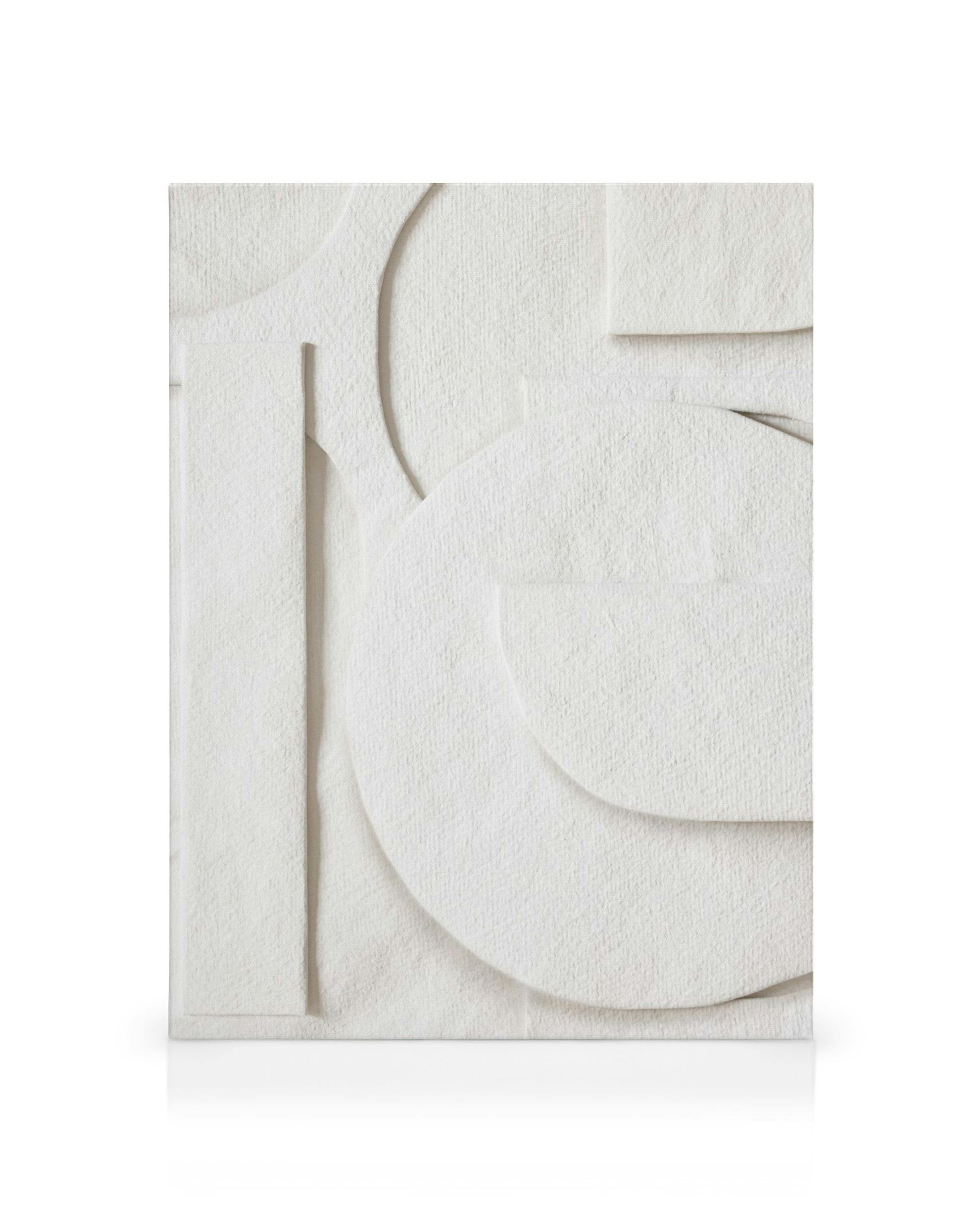 White canvas print with raised geometric paper cut-out shapes, including circles, arcs, and rectangles for a textured effect.